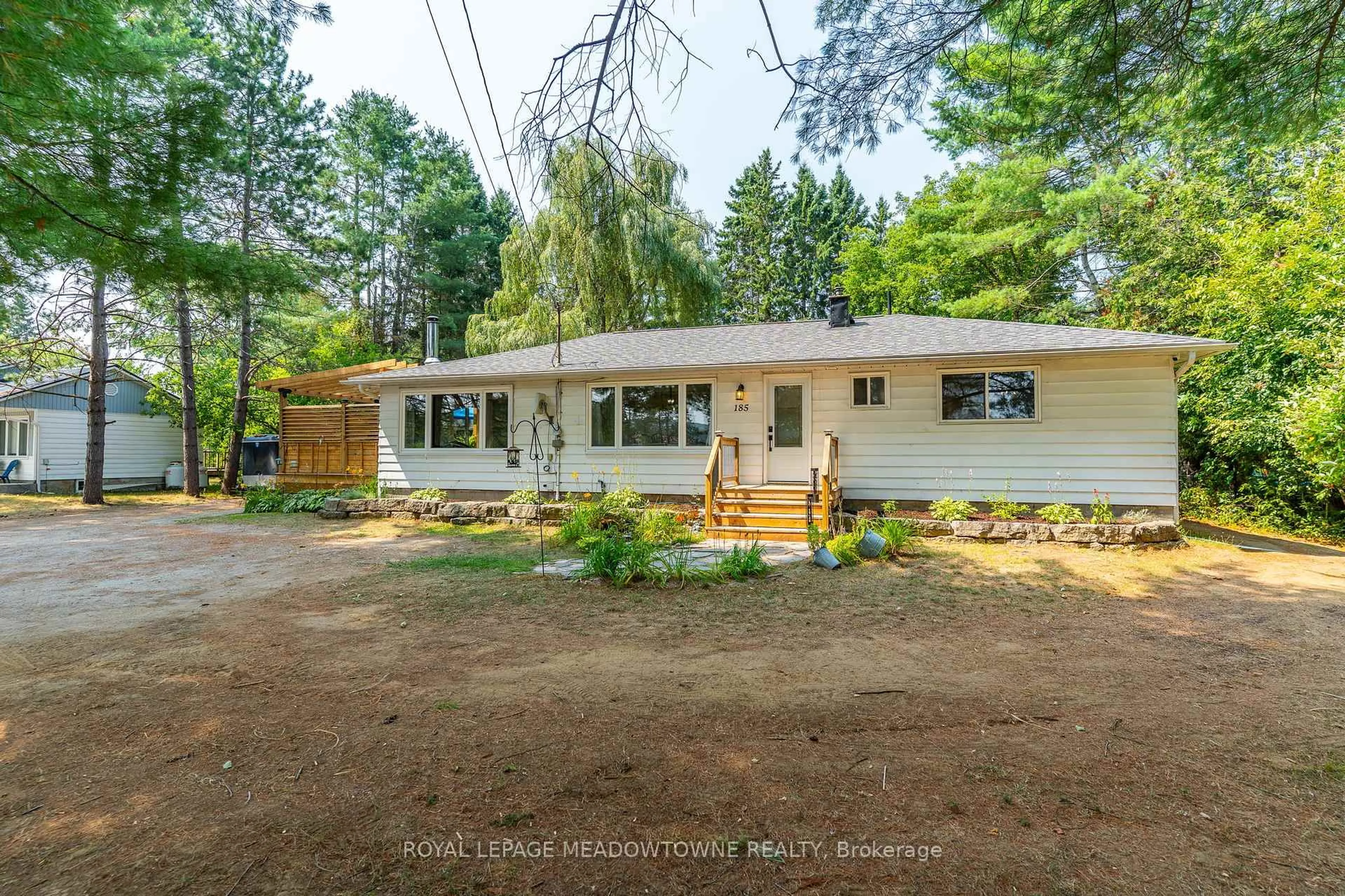 A pic from outside/outdoor area/front of a property/back of a property/a pic from drone, unknown for 185 Bobcaygeon Rd, Minden Hills Ontario K0M 2K0