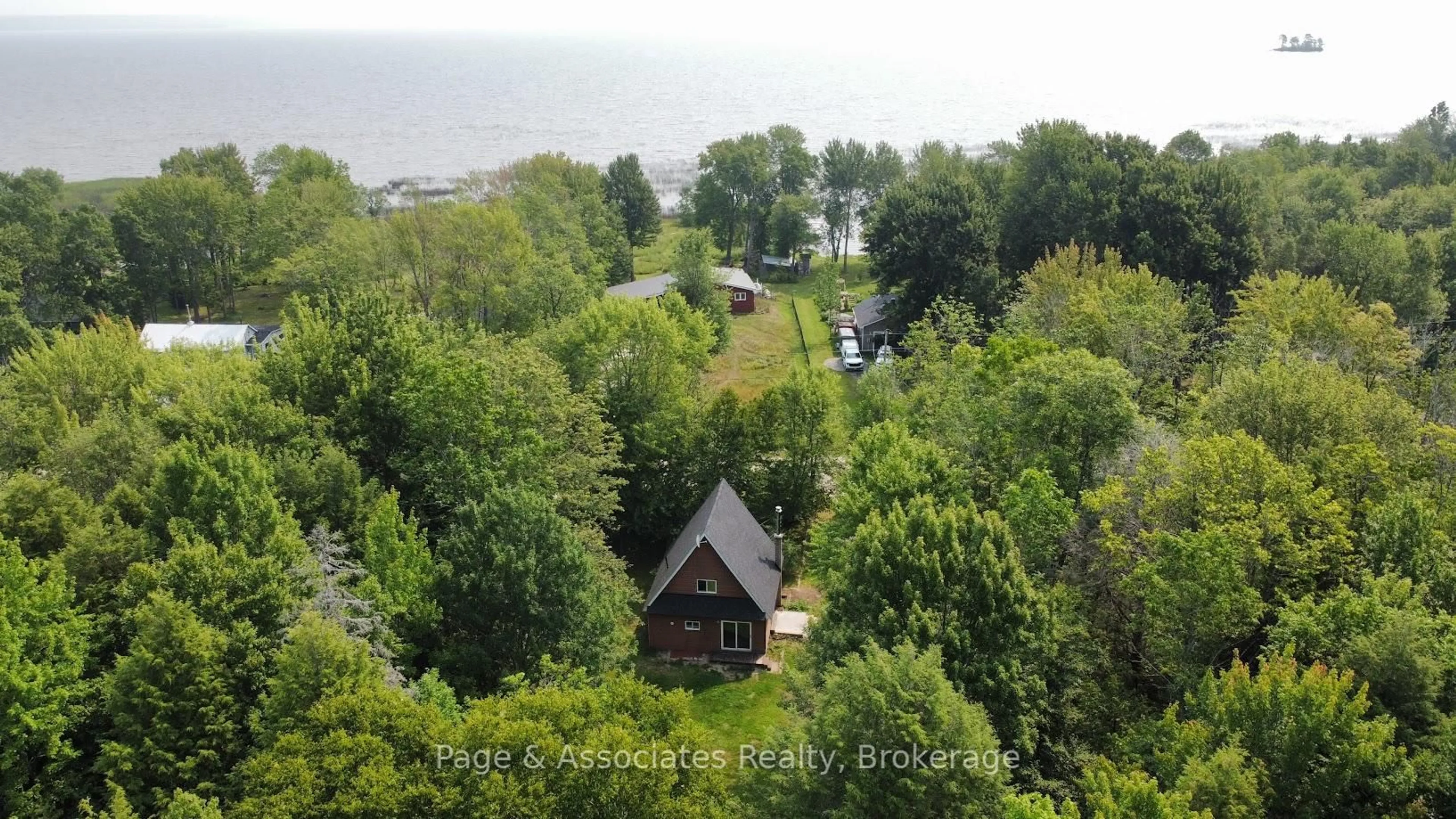 A pic from outside/outdoor area/front of a property/back of a property/a pic from drone, water/lake/river/ocean view for 1854 Jocko Point Rd, North Bay Ontario P1B 8G5