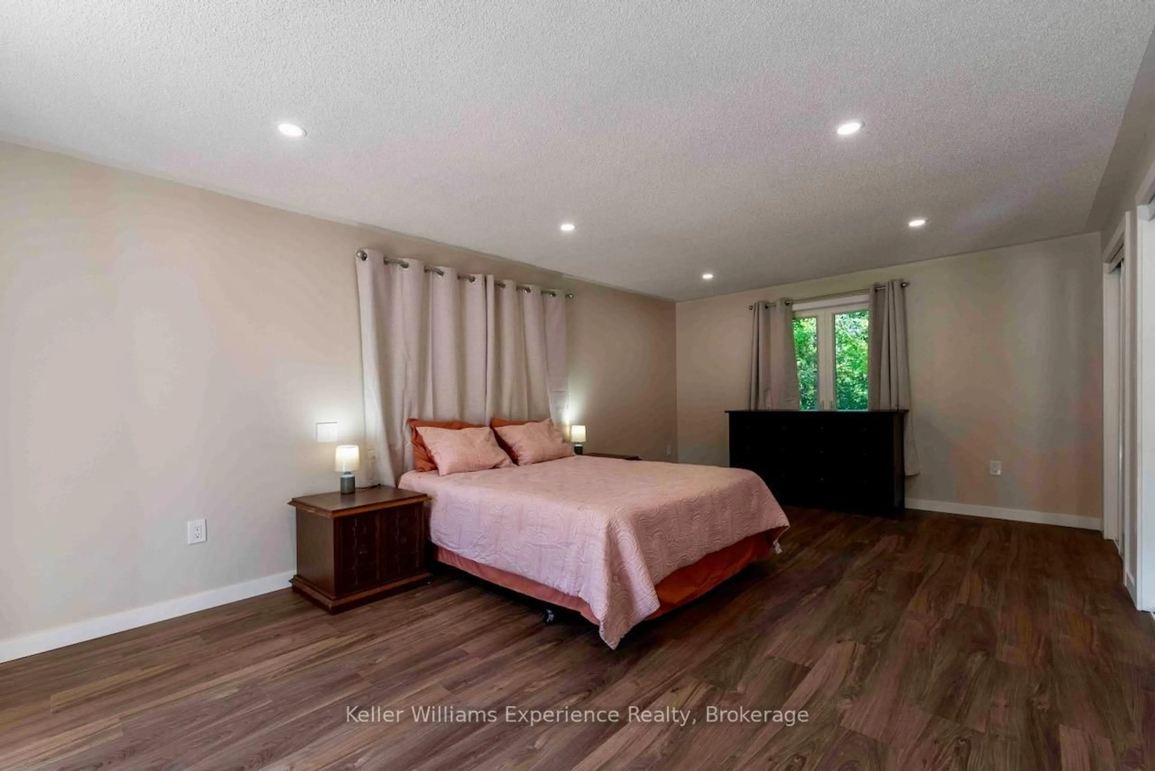 Bedroom with bed, wood/laminate floor for 1496 Uffington Rd, Bracebridge Ontario P1L 1X1