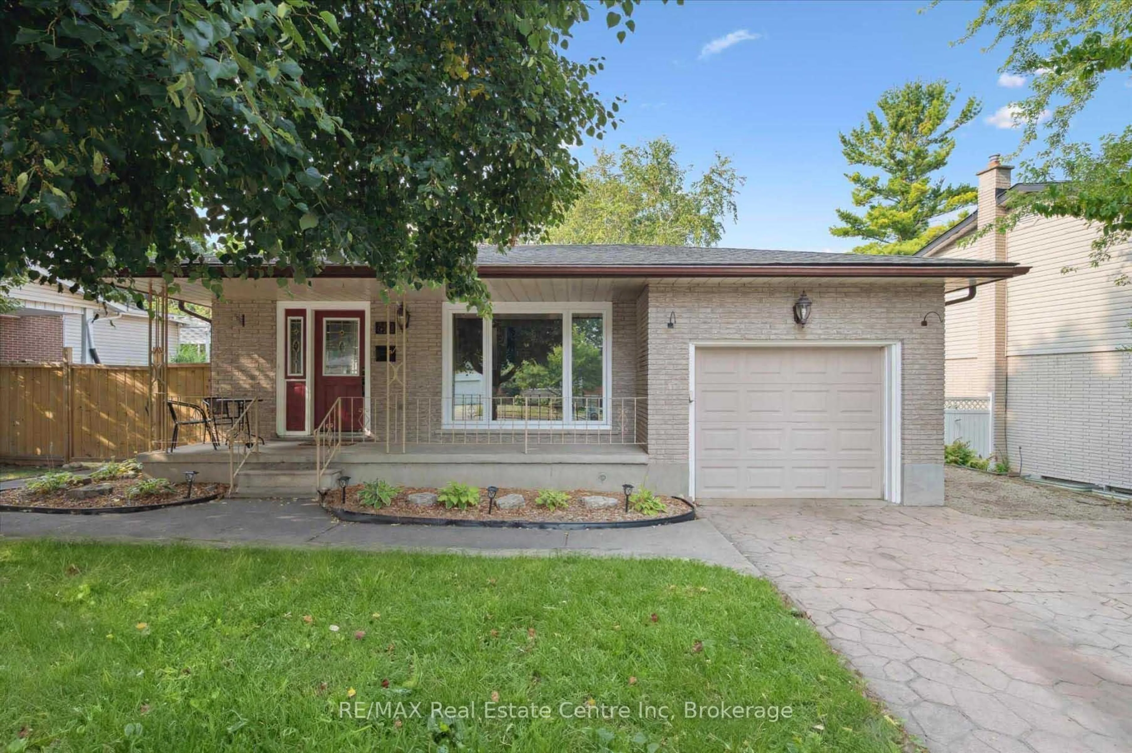Home with vinyl exterior material, street for 69 Rhonda Rd, Guelph Ontario N1H 6H3