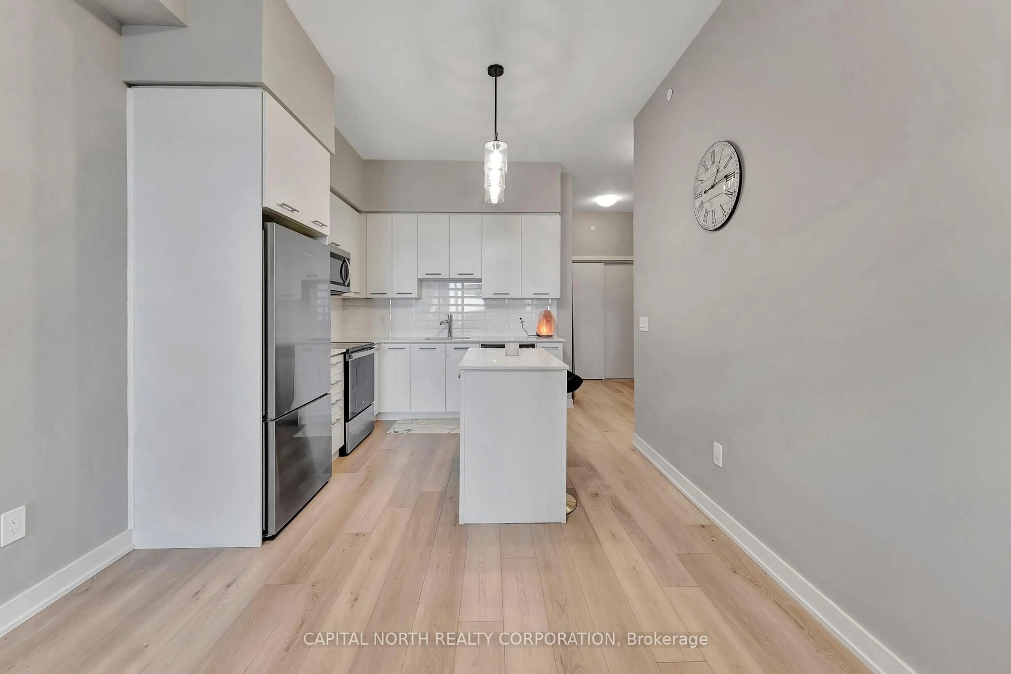 Open concept kitchen, wood/laminate floor for 385 Winston Rd #406, Grimsby Ontario L3M 0J3