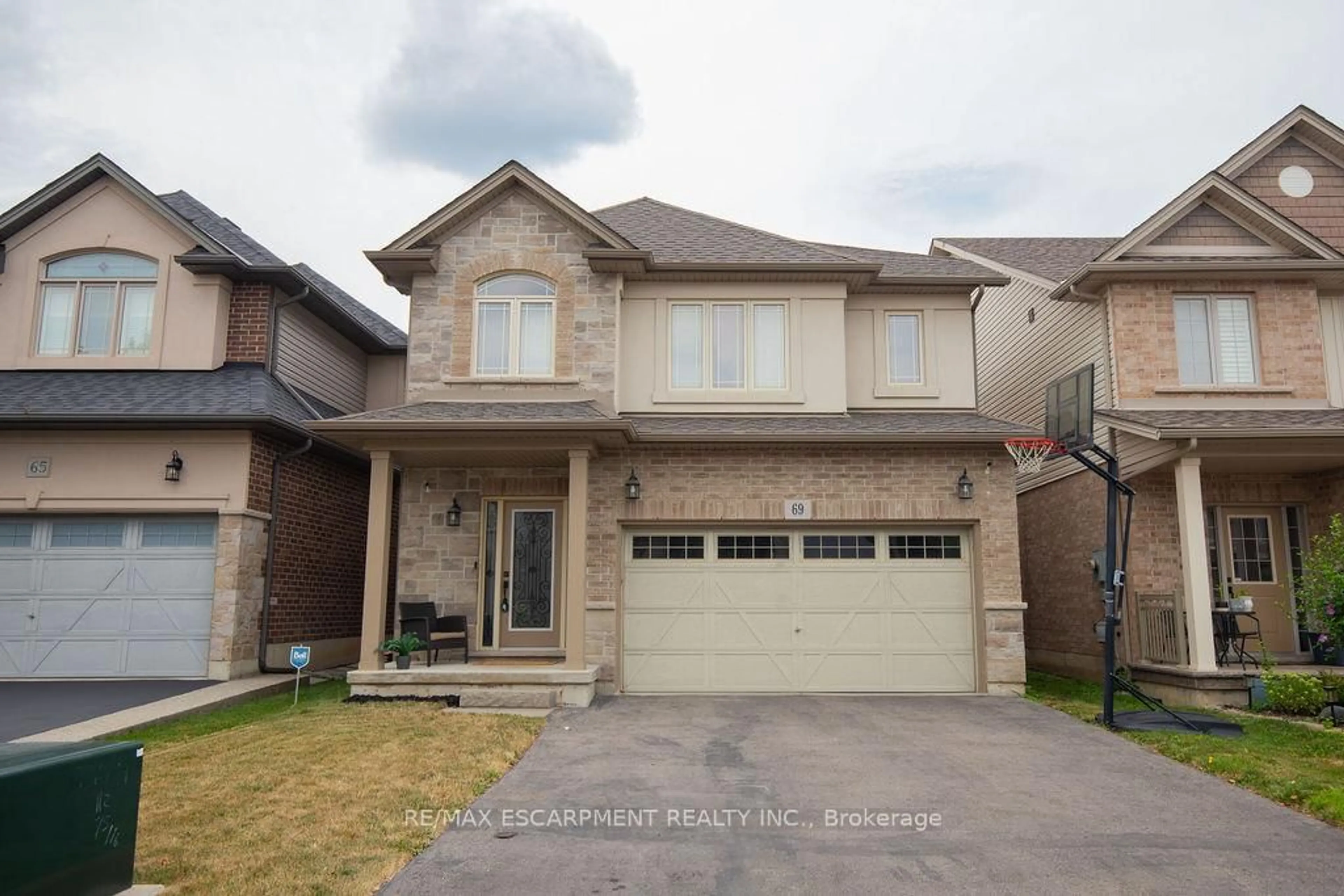 Home with brick exterior material, street for 69 Winslow Way, Hamilton Ontario L8J 0G9