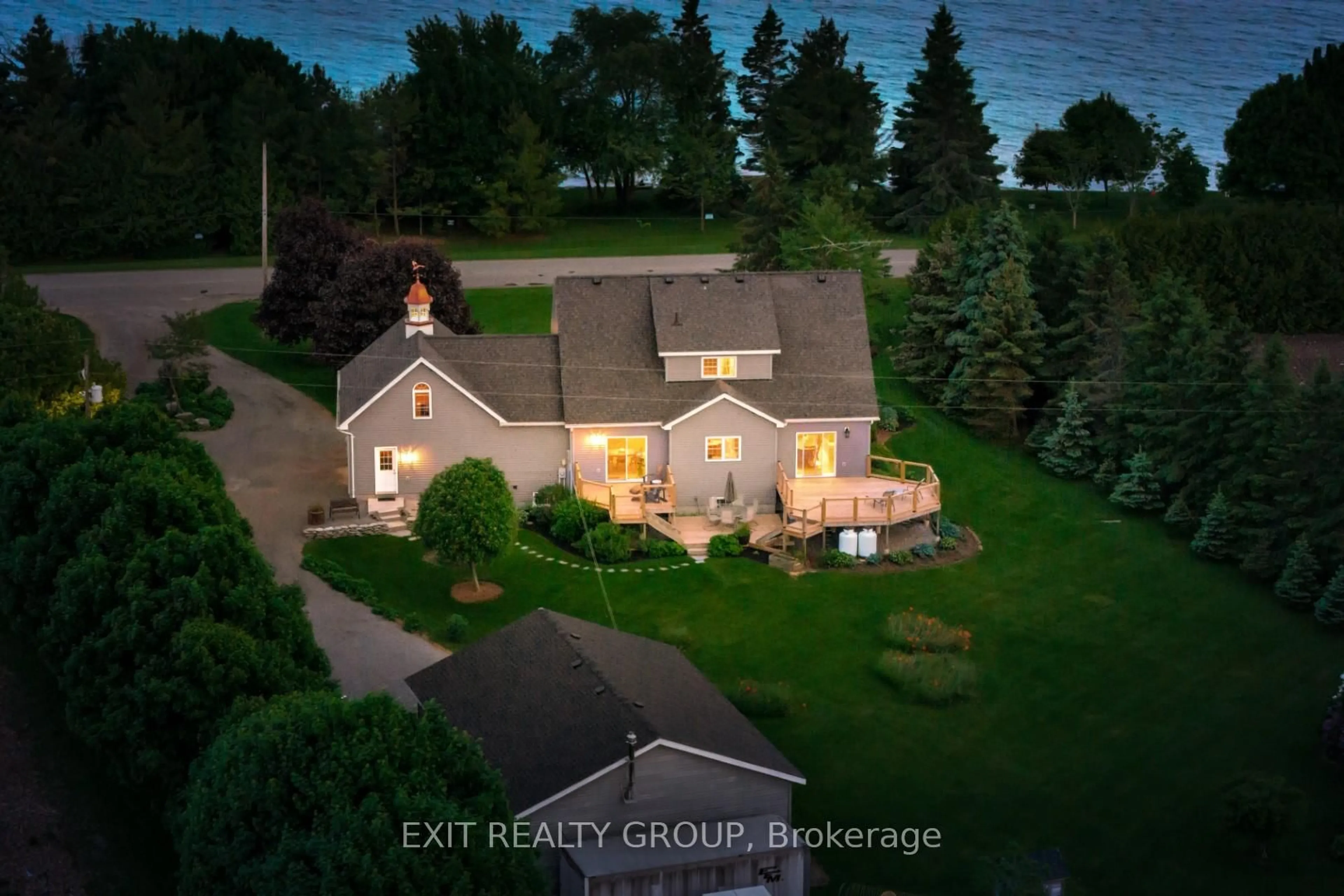 A pic from outside/outdoor area/front of a property/back of a property/a pic from drone, water/lake/river/ocean view for 830 County Rd 20, Prince Edward County Ontario K0K 3L0