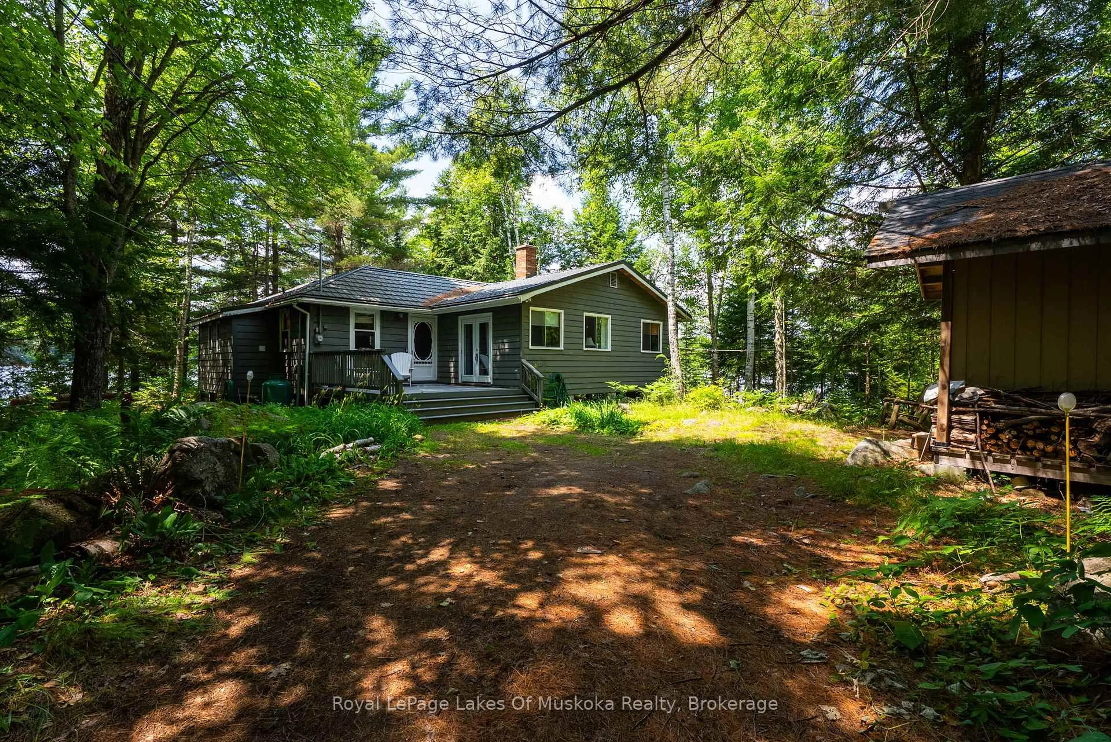 A pic from outside/outdoor area/front of a property/back of a property/a pic from drone, forest/trees view for 1008 Muskoka Bob Rd ##7, Lake of Bays Ontario P0B 1A0