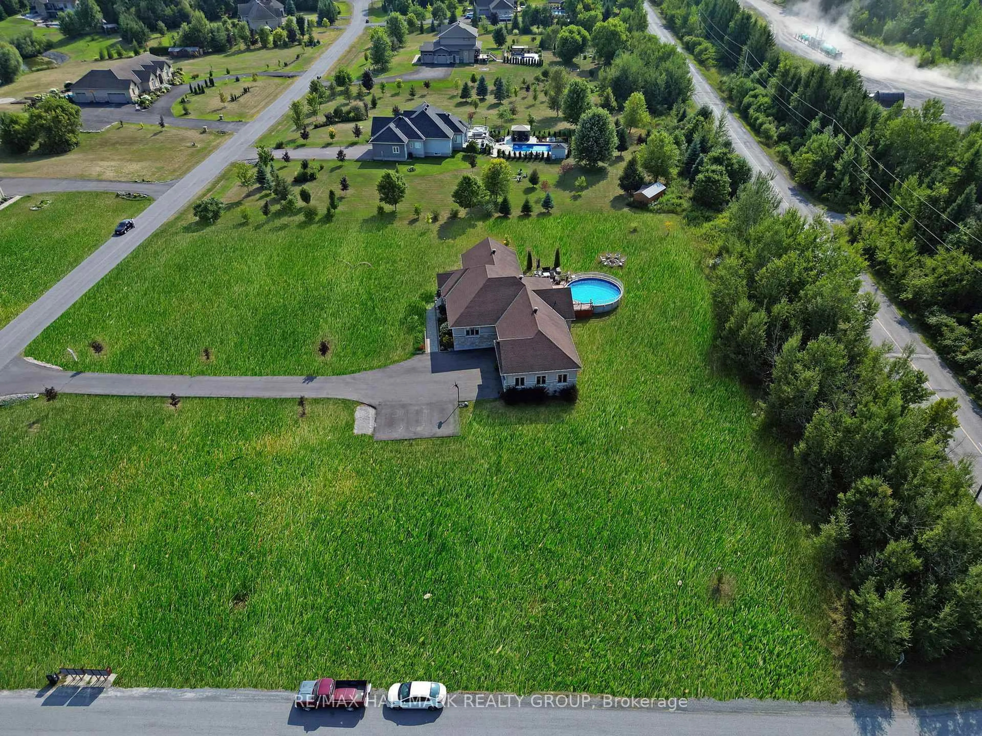 A pic from outside/outdoor area/front of a property/back of a property/a pic from drone, unknown for 210 West Lake Circ, Carp Ontario K0A 1L0