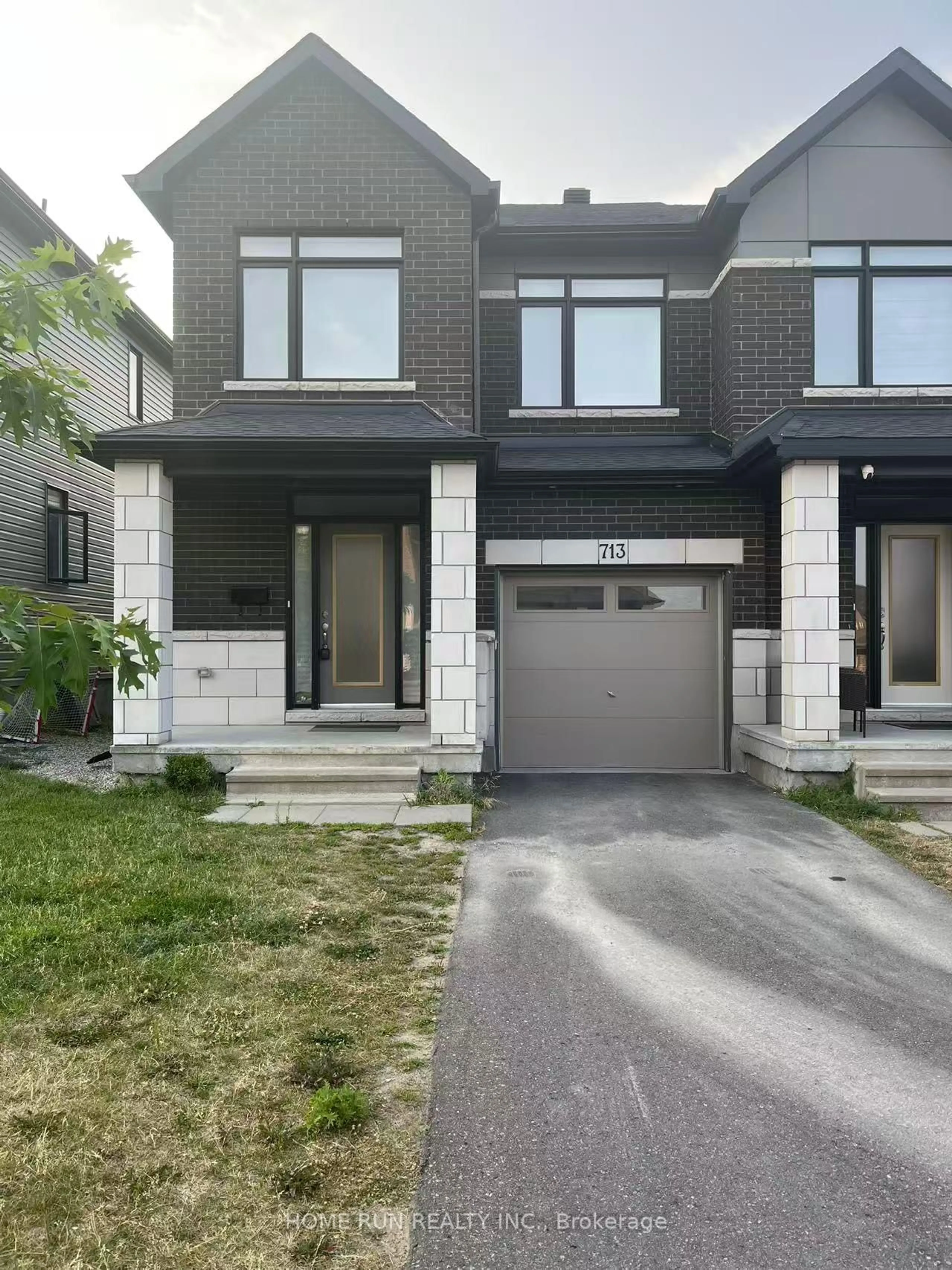 Home with brick exterior material, street for 713 Teasel Way, Ottawa Ontario K1T 0M1