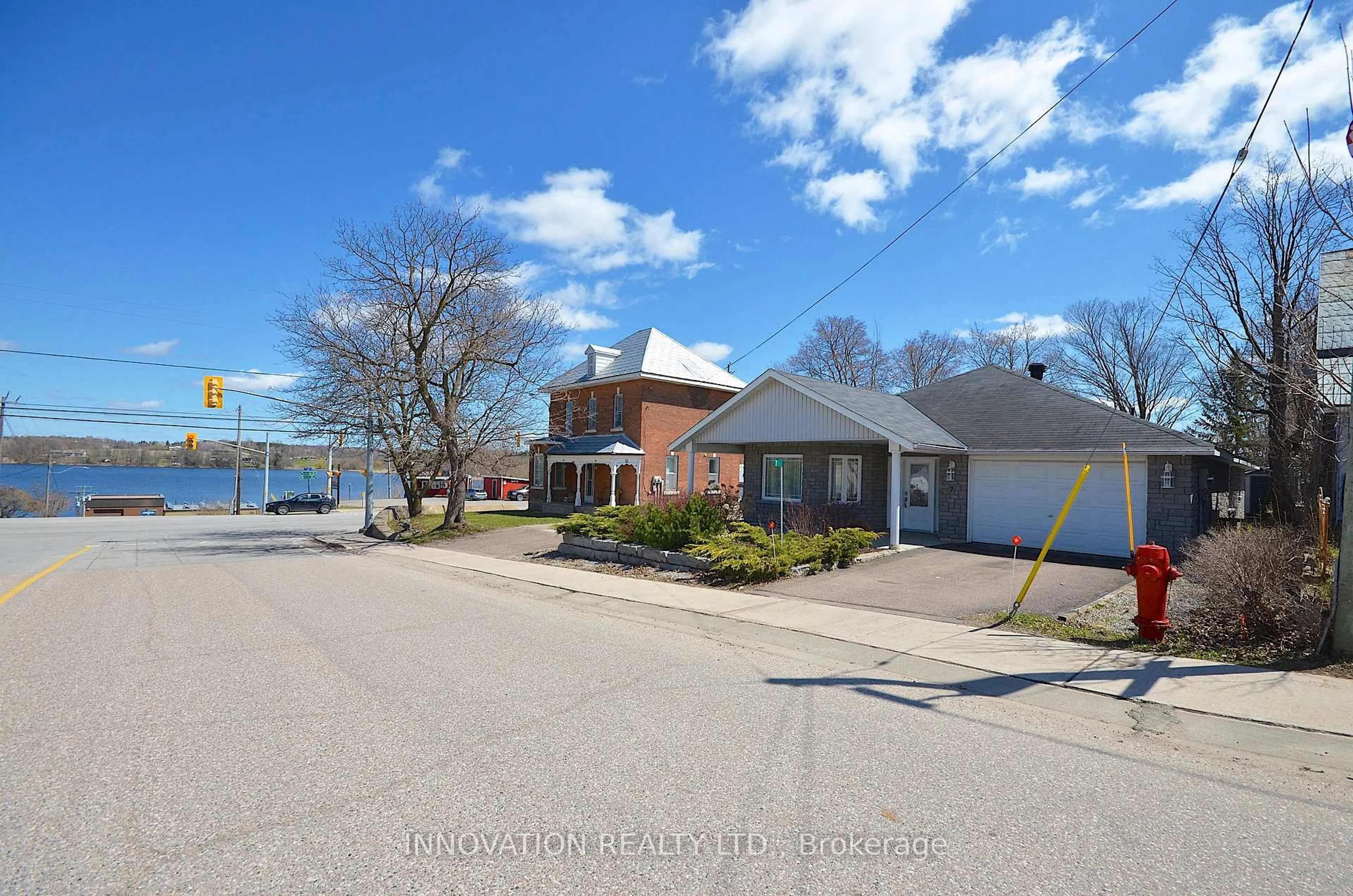 A pic from outside/outdoor area/front of a property/back of a property/a pic from drone, water/lake/river/ocean view for 7 Main St, Cobden Ontario K0J 1K0