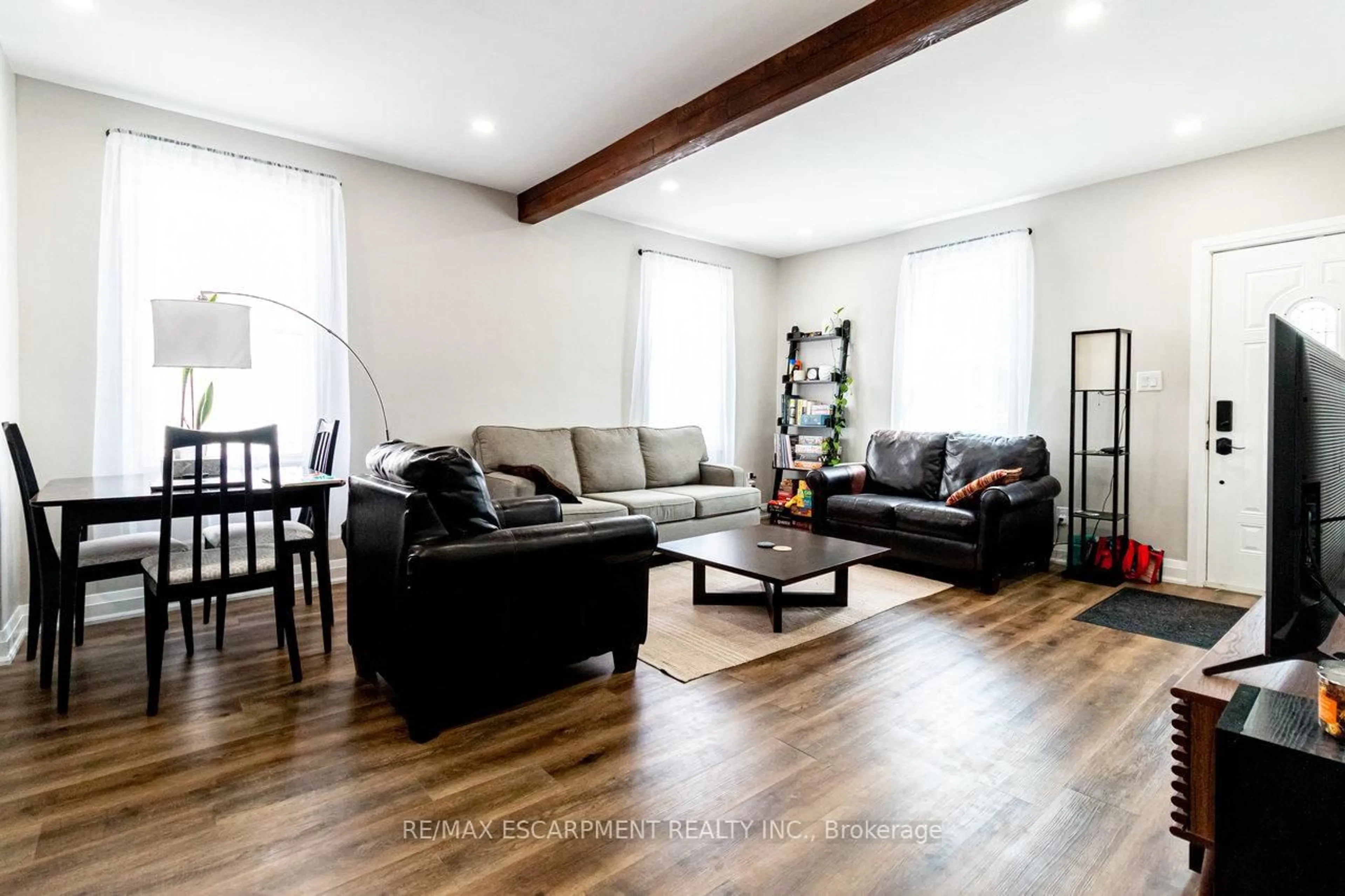 Living room with furniture, wood/laminate floor for 773 Lawrence Rd, Hamilton Ontario L8K 1Z7
