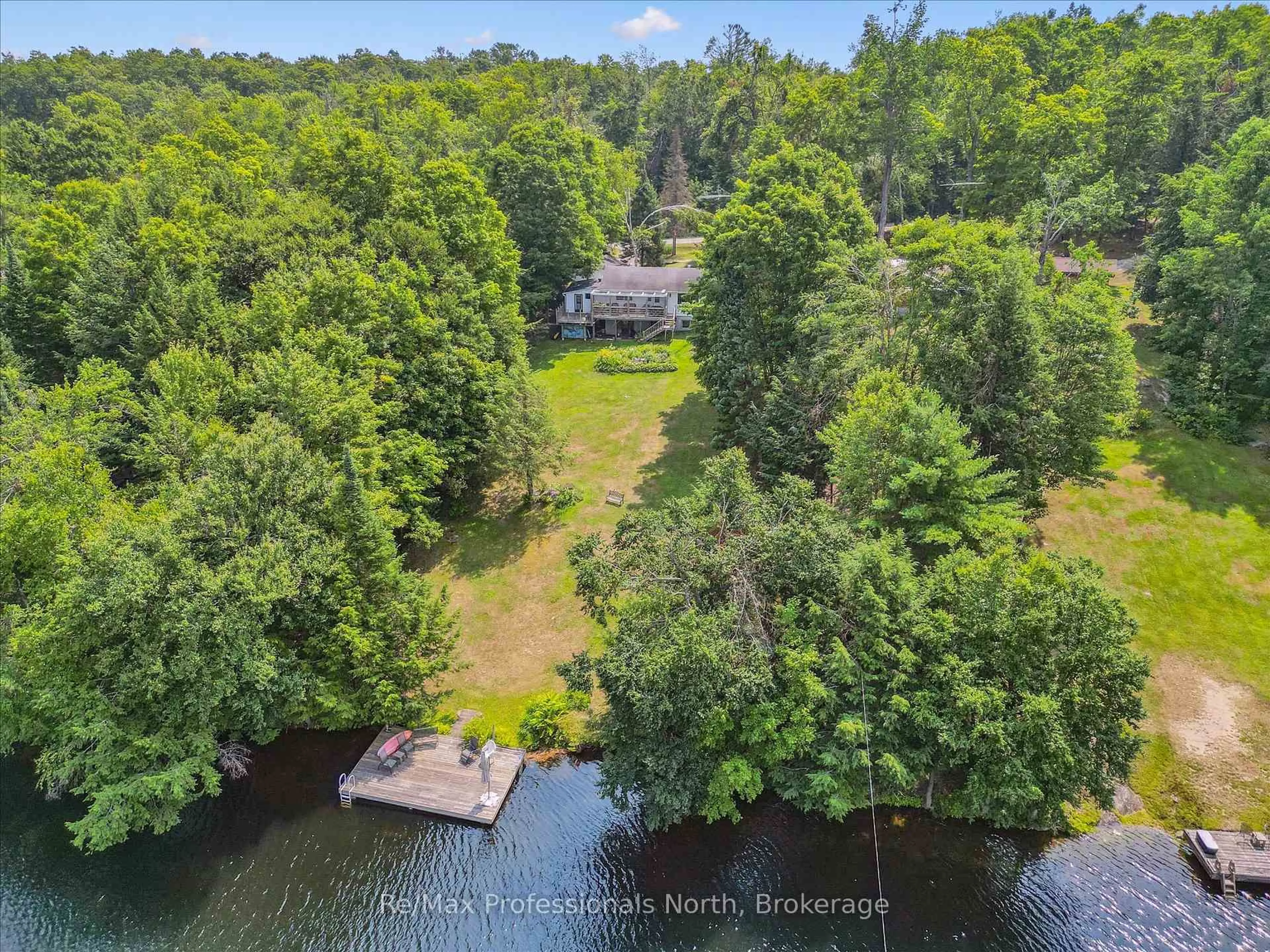 A pic from outside/outdoor area/front of a property/back of a property/a pic from drone, water/lake/river/ocean view for 1042 River Haven Rd, Bracebridge Ontario P1L 1X1