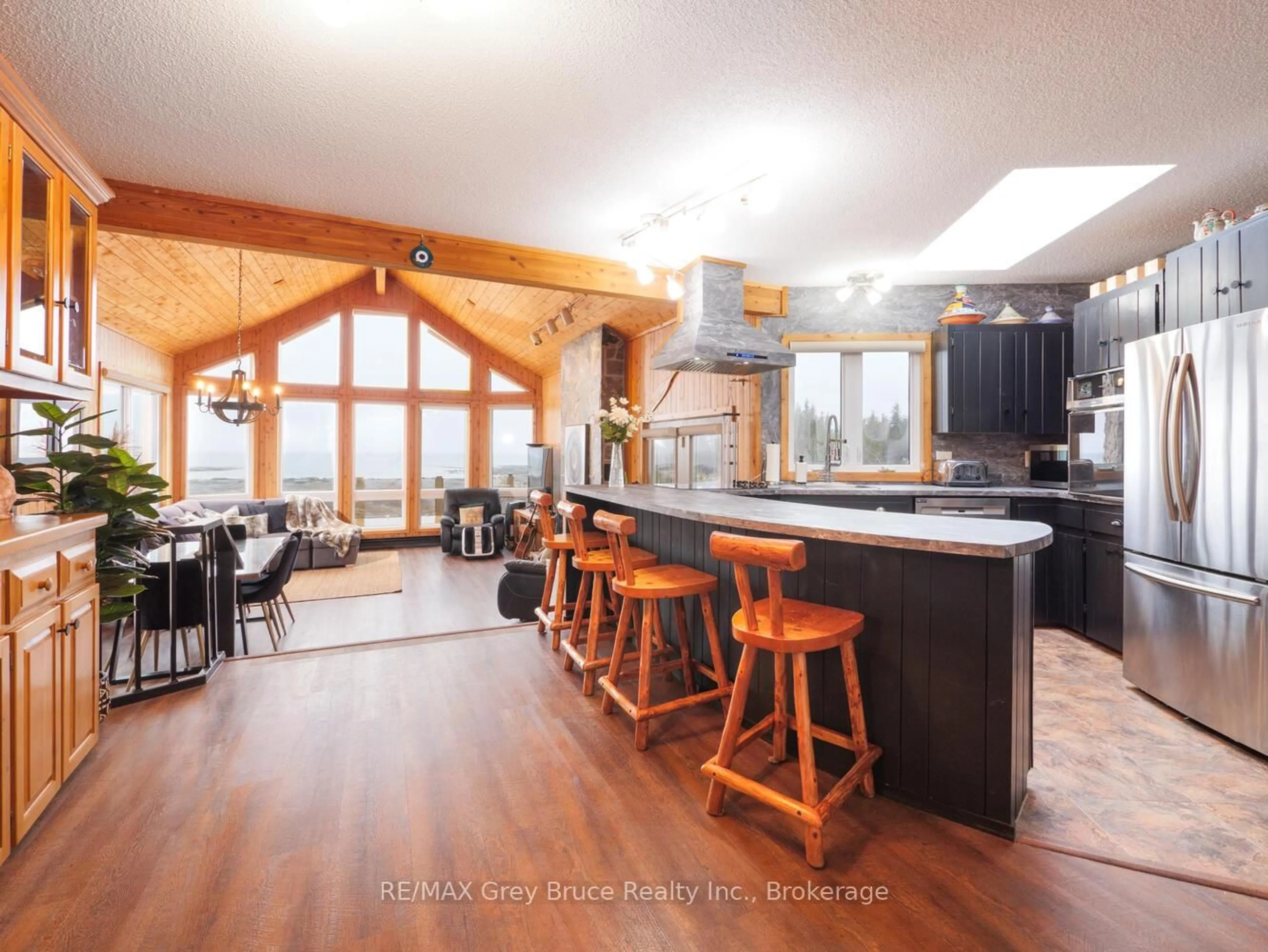 Open concept kitchen, wood/laminate floor for 157 Zorra Dr, Northern Bruce Peninsula Ontario N0H 2R0