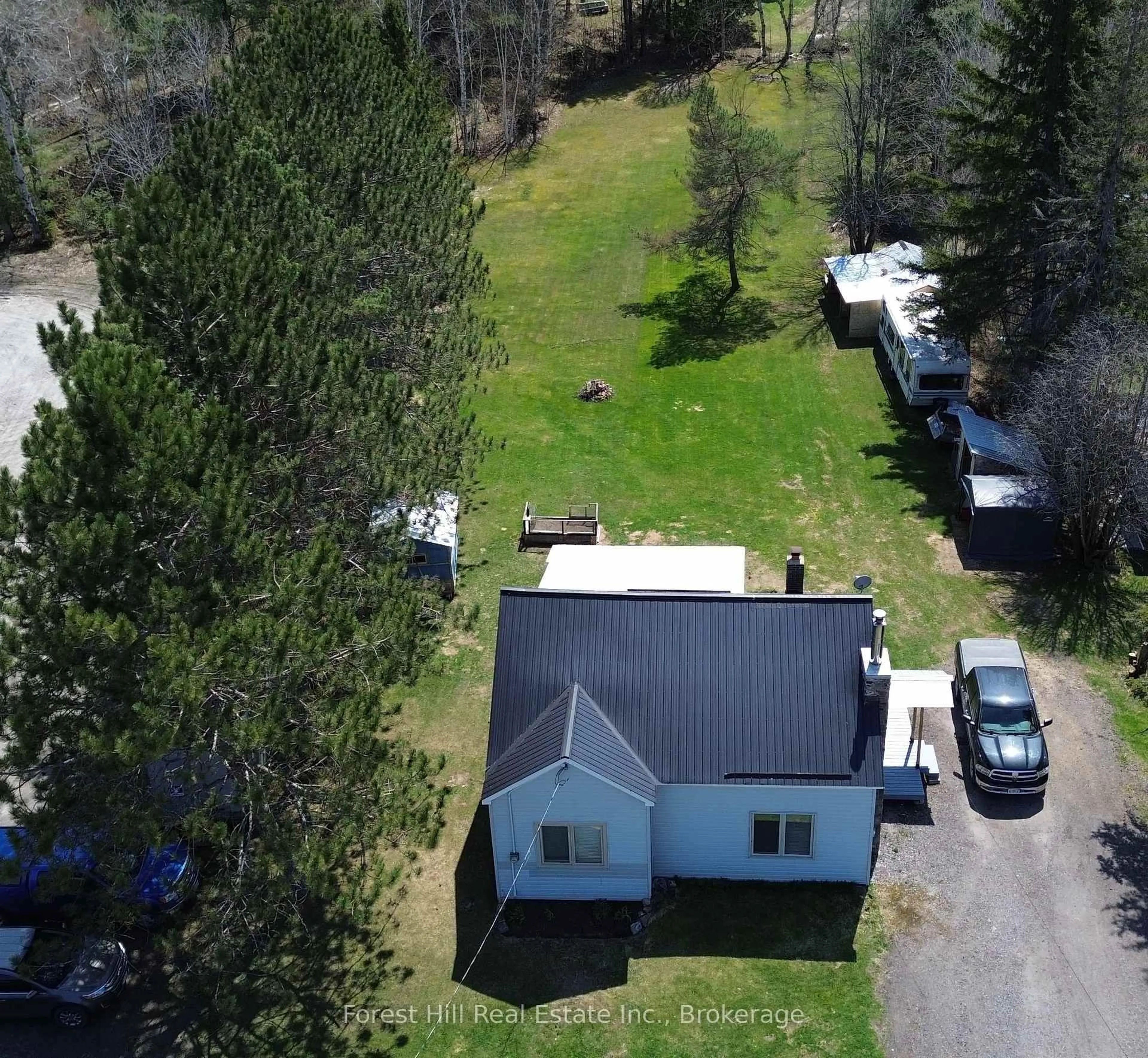 A pic from outside/outdoor area/front of a property/back of a property/a pic from drone, street for 10709 522 Highway, Parry Sound Remote Area Ontario P0H 1A0