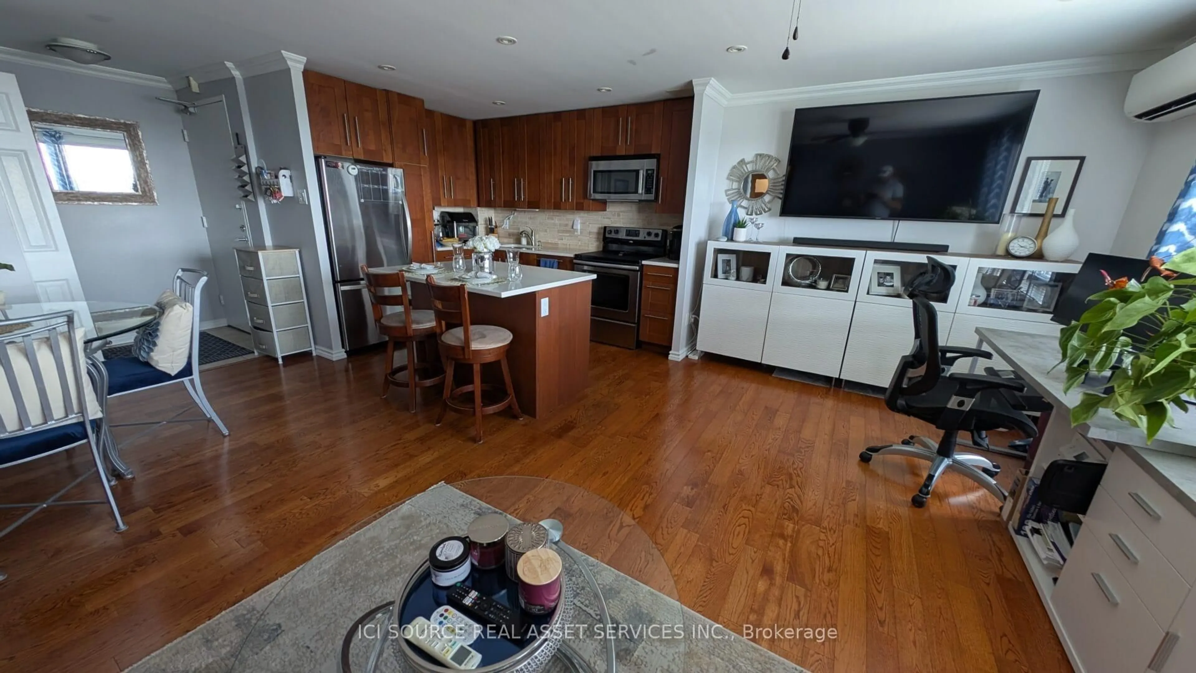 Open concept kitchen, wood/laminate floor for 20 Chesterton Dr #711, Ottawa Ontario K2E 6Z7