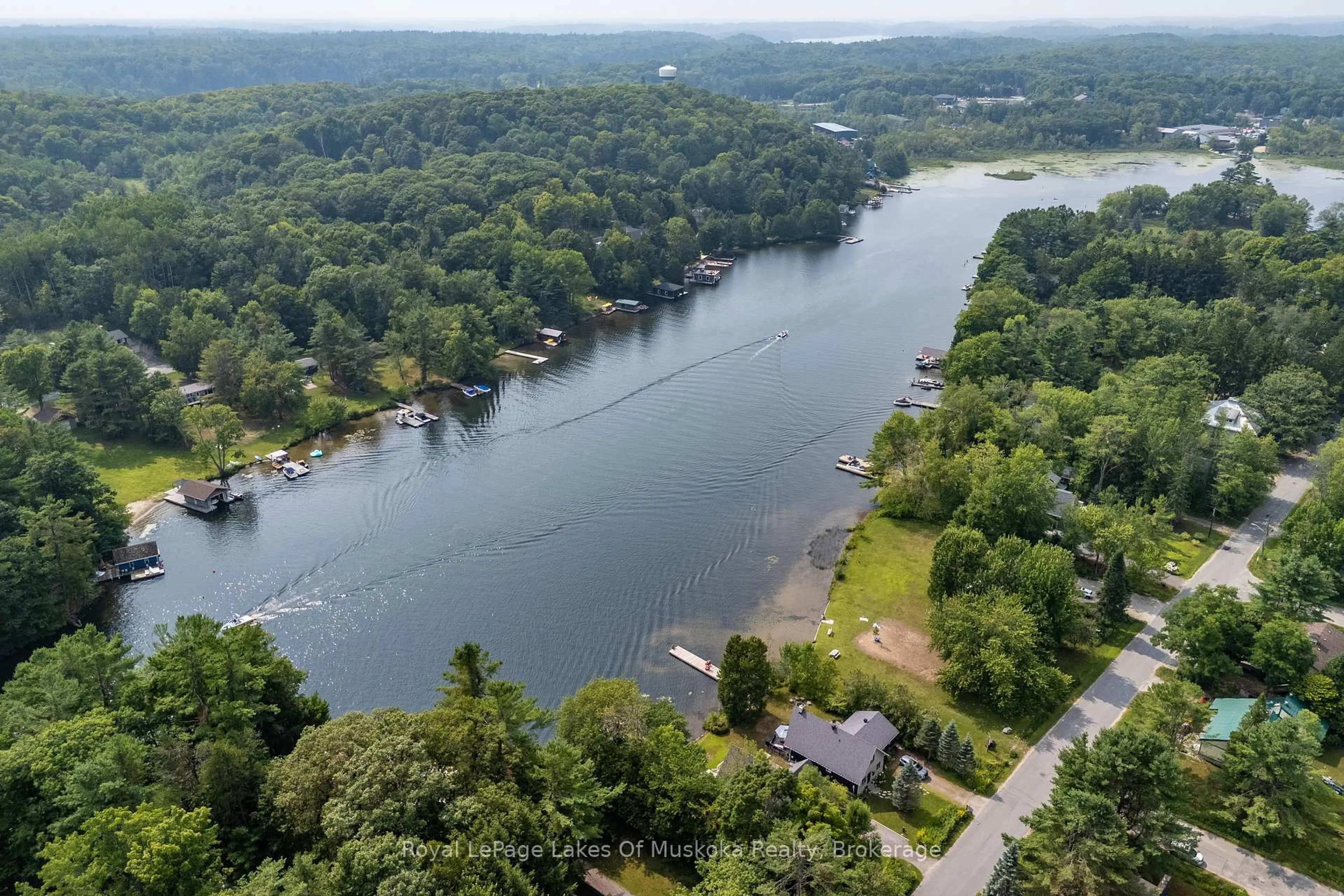 A pic from outside/outdoor area/front of a property/back of a property/a pic from drone, water/lake/river/ocean view for 21 Harris St, Muskoka Lakes Ontario P0B 1J0
