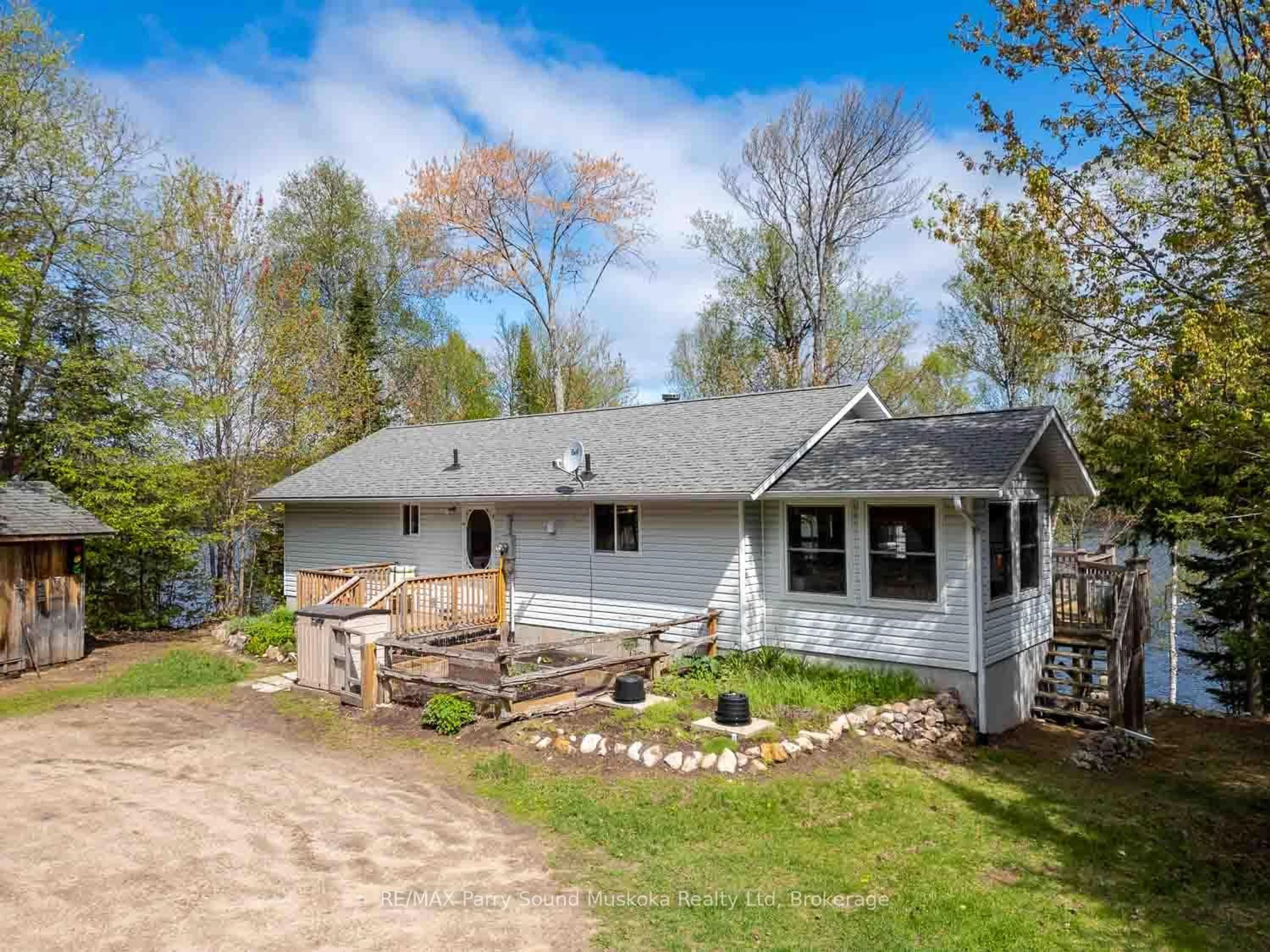 A pic from outside/outdoor area/front of a property/back of a property/a pic from drone, unknown for 1931 B South Horn Lake Rd, Magnetawan Ontario P0A 1C0