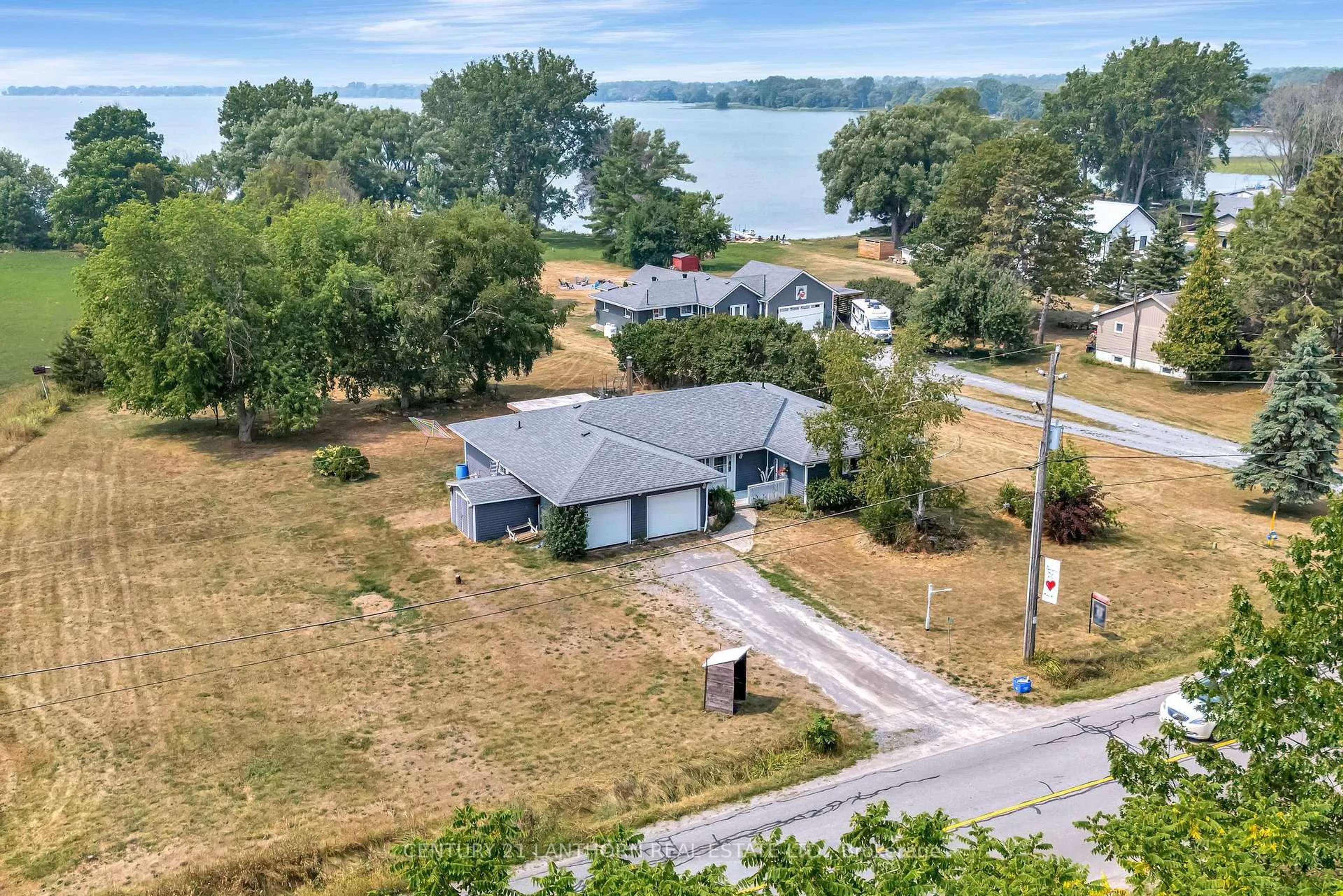 A pic from outside/outdoor area/front of a property/back of a property/a pic from drone, water/lake/river/ocean view for 263 County Rd 29 Rd, Prince Edward County Ontario K0K 1T0