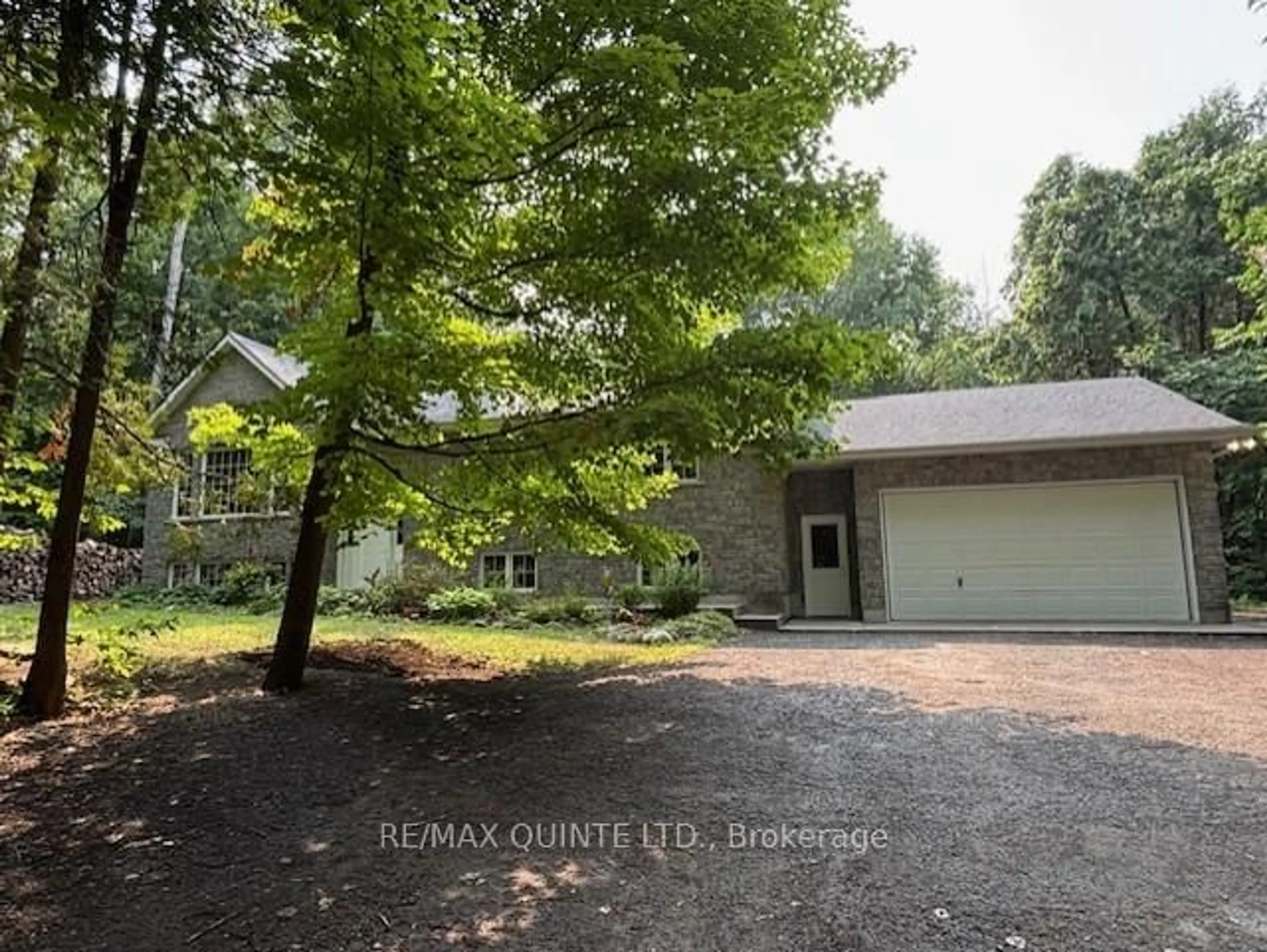 A pic from outside/outdoor area/front of a property/back of a property/a pic from drone, forest/trees view for 156 Tracey Rd, Belleville Ontario K0K 2Y0