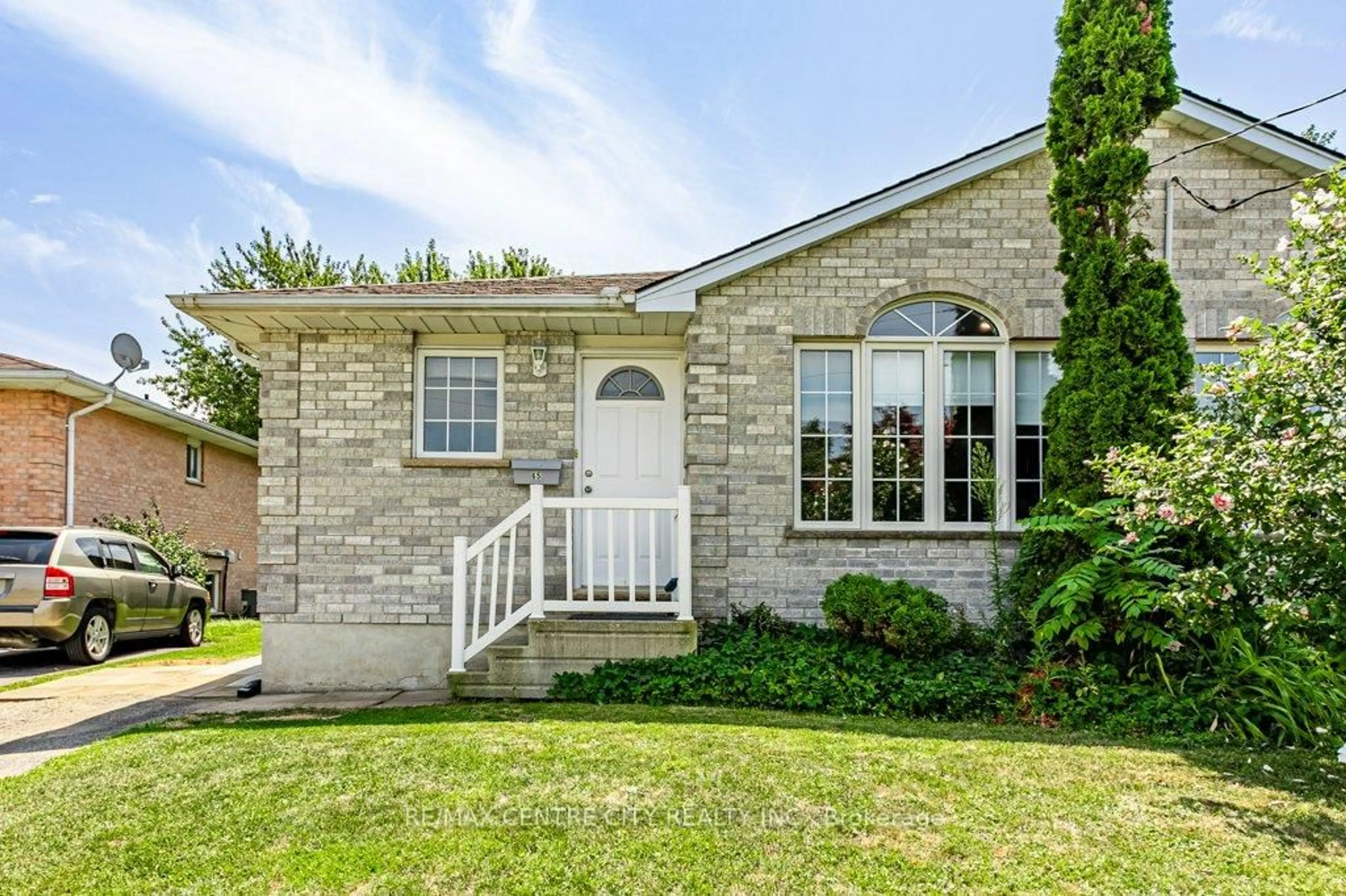 Home with brick exterior material, street for 65 Edward St, St. Thomas Ontario N5P 1Y5