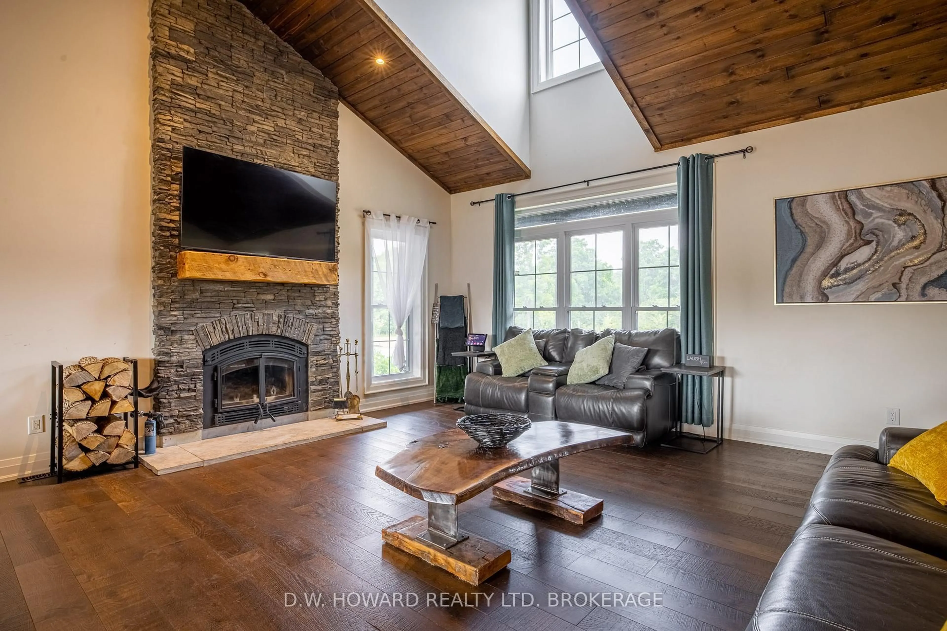 Living room with furniture, wood/laminate floor for 1599 Teal Rd, Fort Erie Ontario L0S 1N0