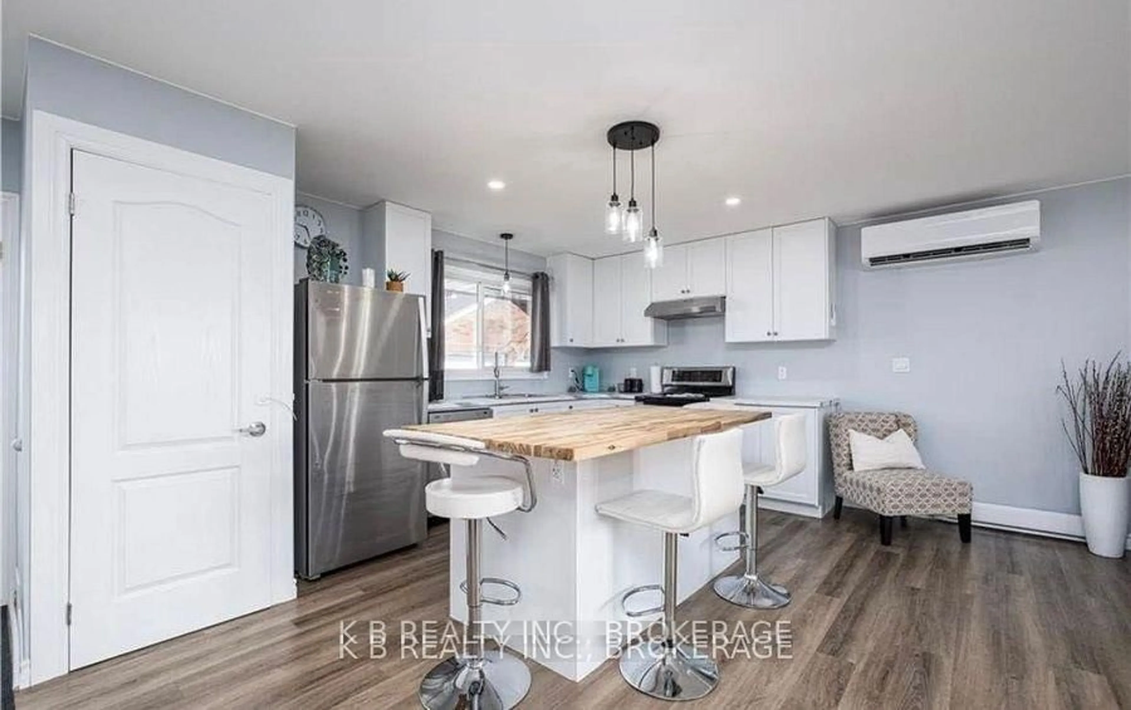 Open concept kitchen, wood/laminate floor for 172 Morenz Cres, Kingston Ontario K7K 2X3