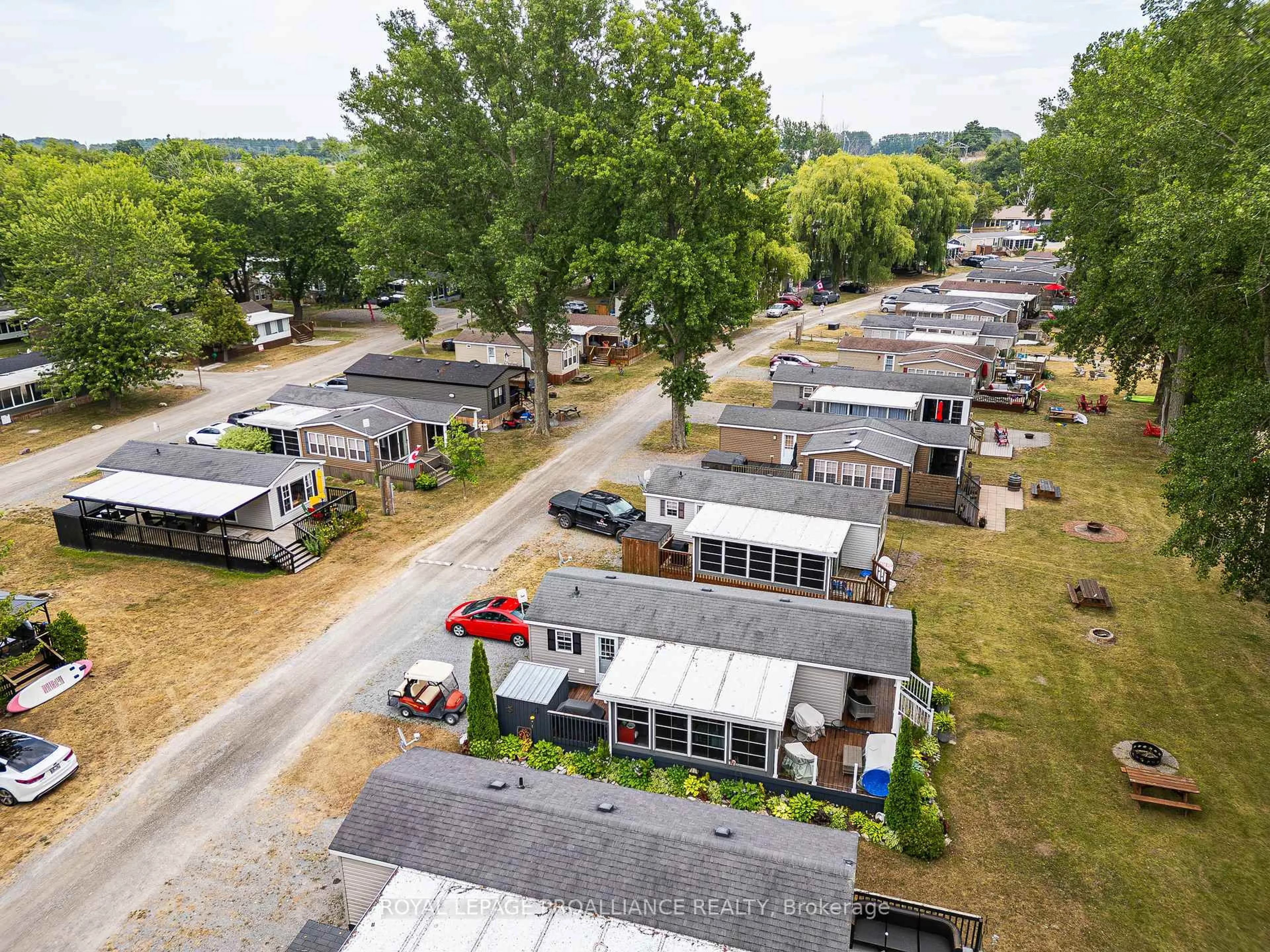 A pic from outside/outdoor area/front of a property/back of a property/a pic from drone, street for 486 County Road 18 #26 Beach View Lane, Prince Edward County Ontario K0K 1P0