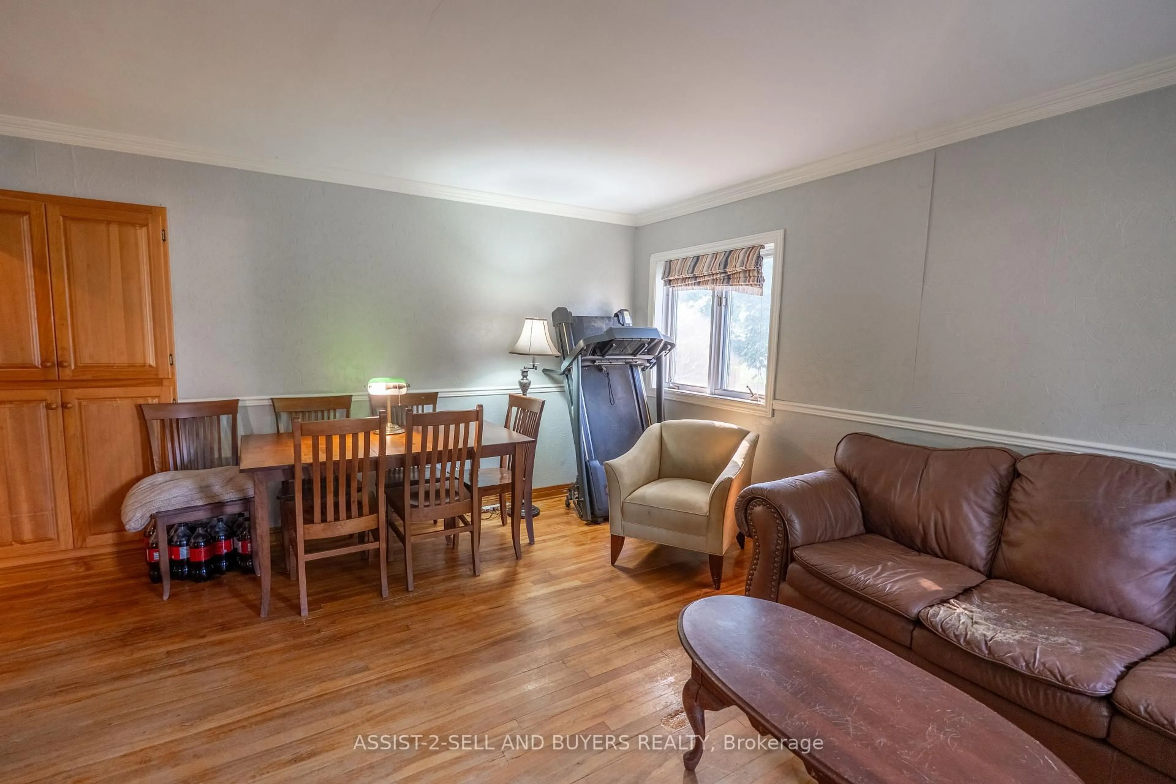 Living room with furniture, wood/laminate floor for 310 Westmoreland Ave, Cornwall Ontario K6J 2G9
