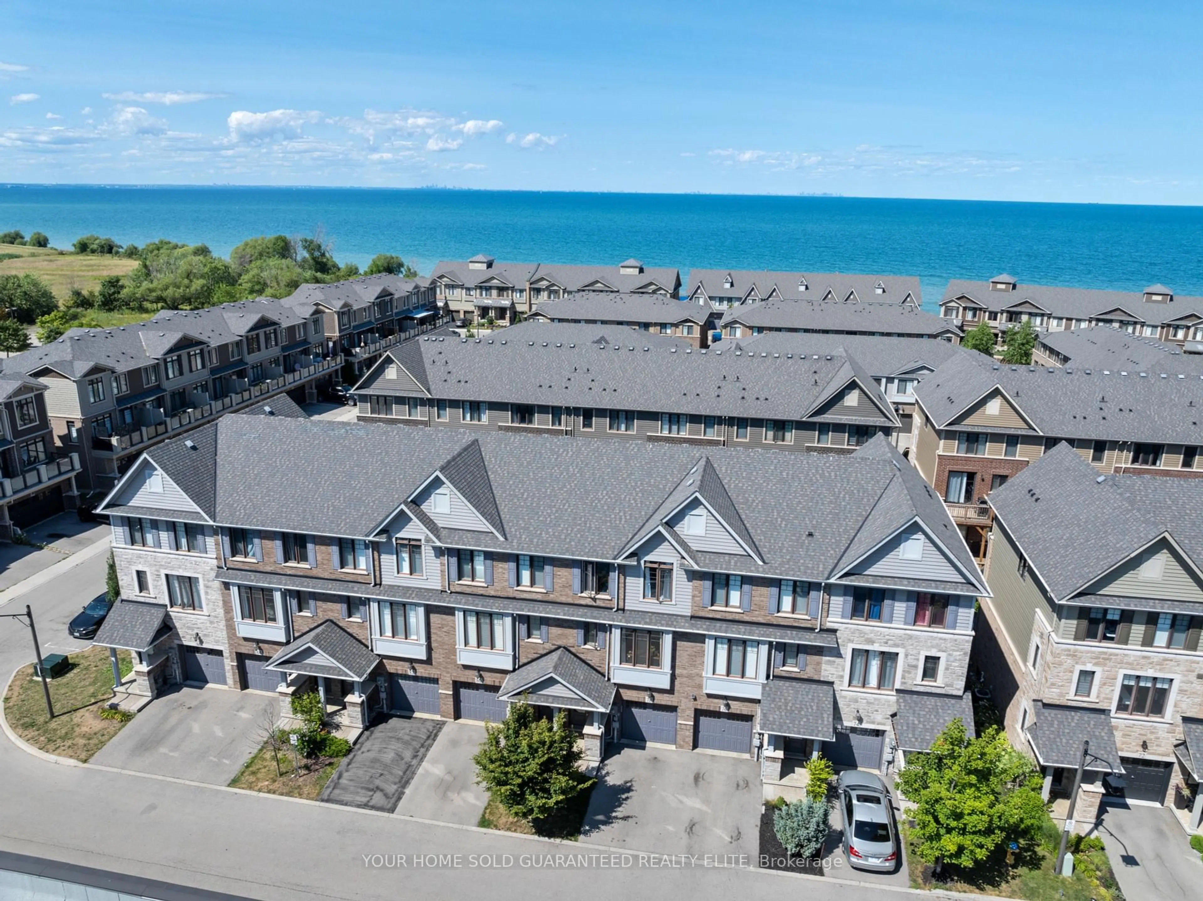 A pic from outside/outdoor area/front of a property/back of a property/a pic from drone, water/lake/river/ocean view for 78 Esplanade Lane, Grimsby Ontario L3M 0H2