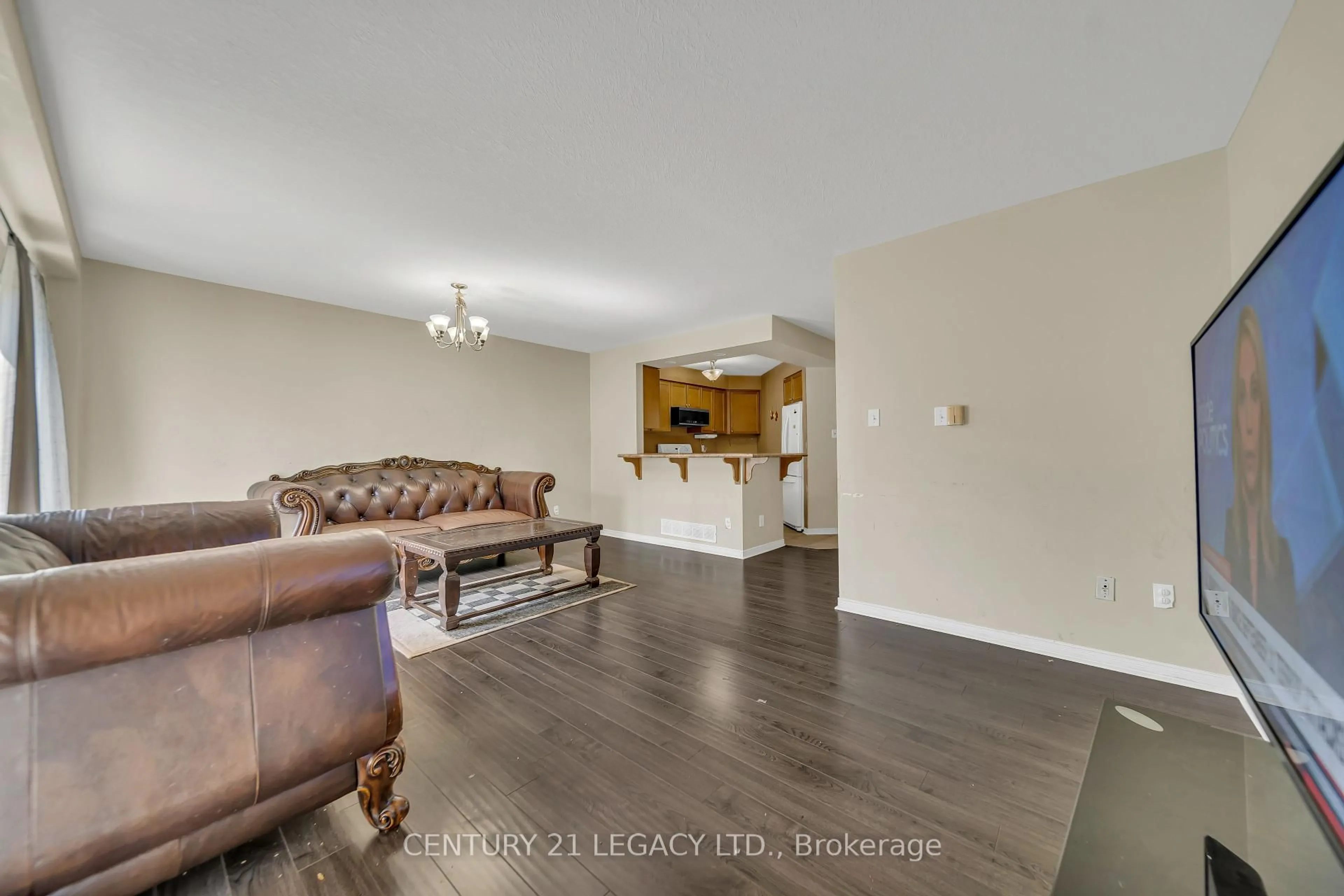 Living room with furniture, wood/laminate floor for 217 Cotton Grass St, Kitchener Ontario N2E 4A5
