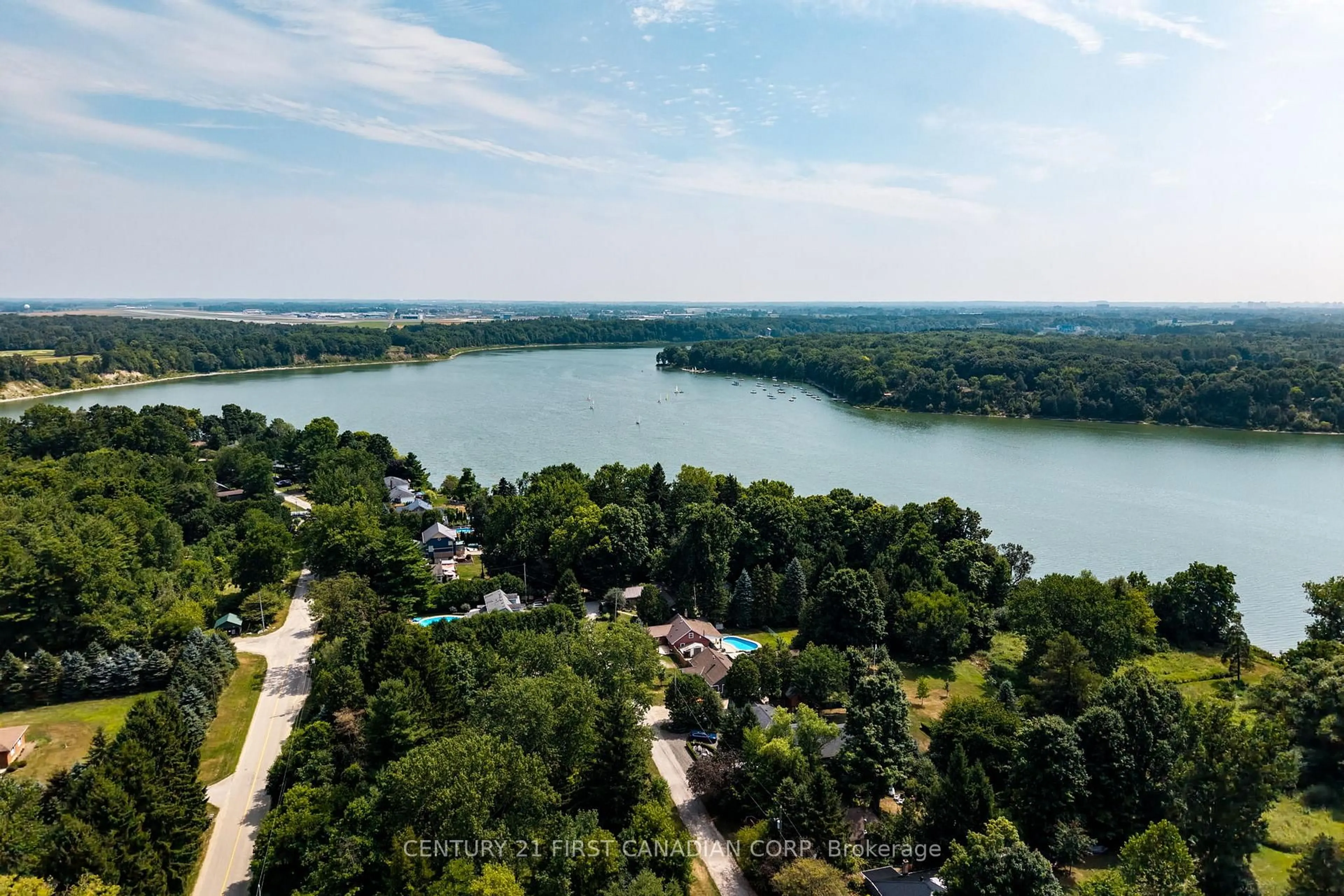 A pic from outside/outdoor area/front of a property/back of a property/a pic from drone, water/lake/river/ocean view for 21084 Riverview Dr, Thames Centre Ontario N0M 2P0