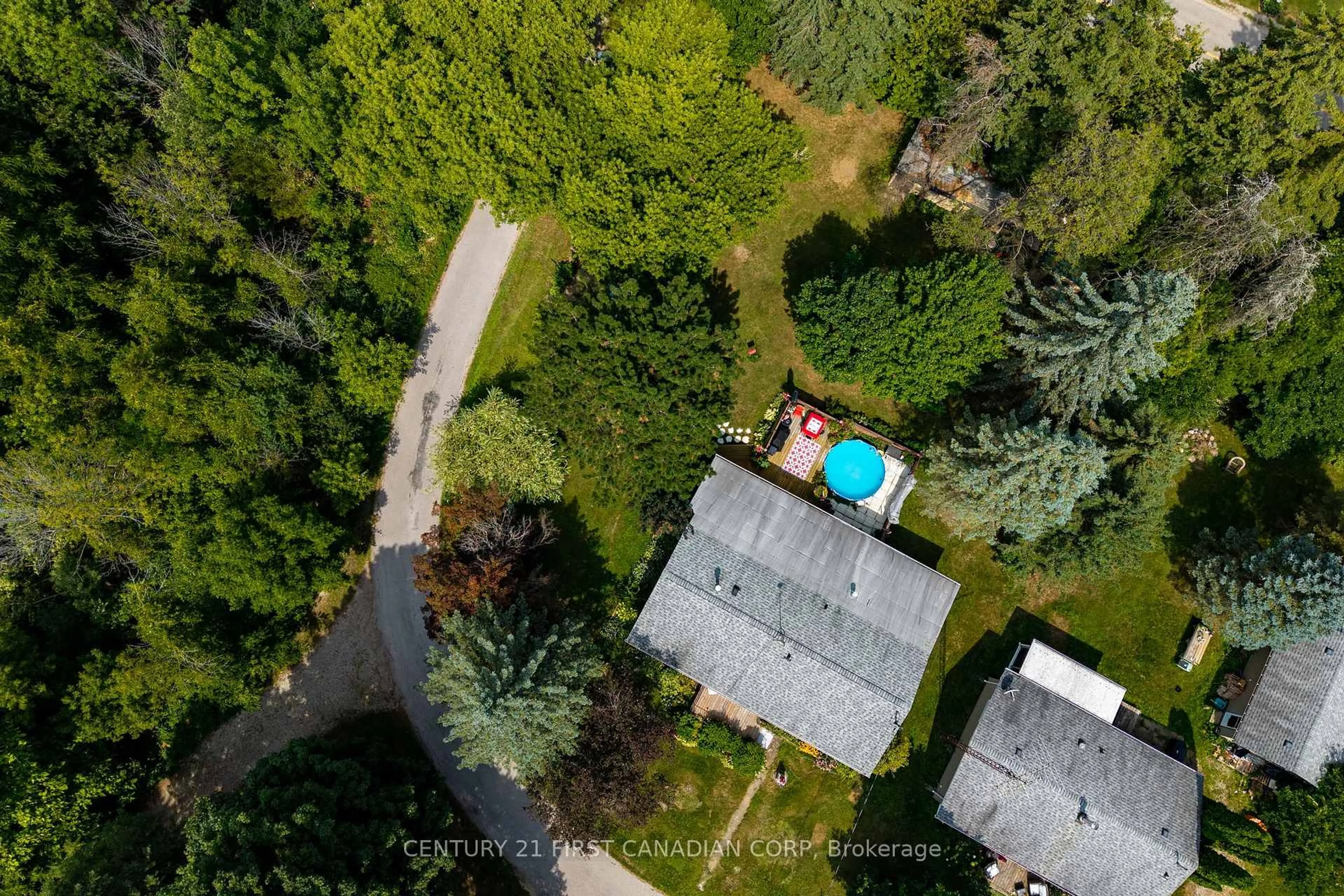 A pic from outside/outdoor area/front of a property/back of a property/a pic from drone, forest/trees view for 21084 Riverview Dr, Thames Centre Ontario N0M 2P0