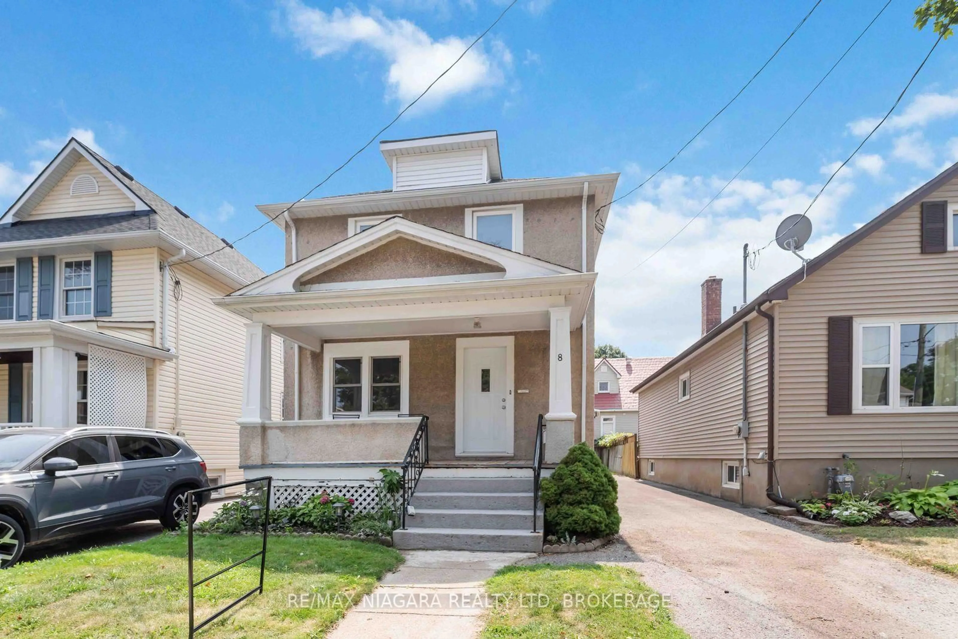 Home with vinyl exterior material, street for 8 Russell Ave, St. Catharines Ontario L2R 1T9