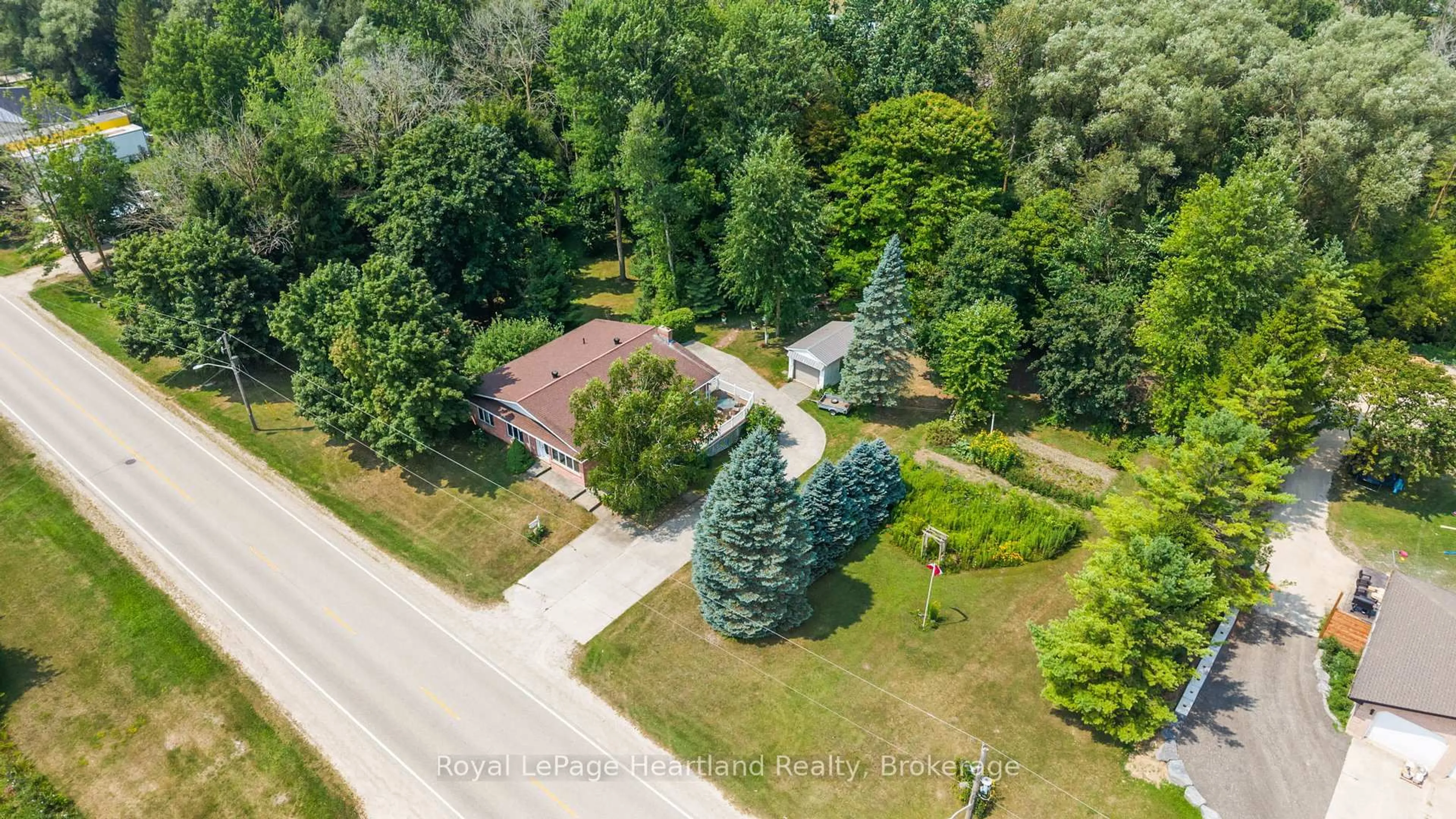 A pic from outside/outdoor area/front of a property/back of a property/a pic from drone, forest/trees view for 23 Mill St, Minto Ontario N0G 1M0