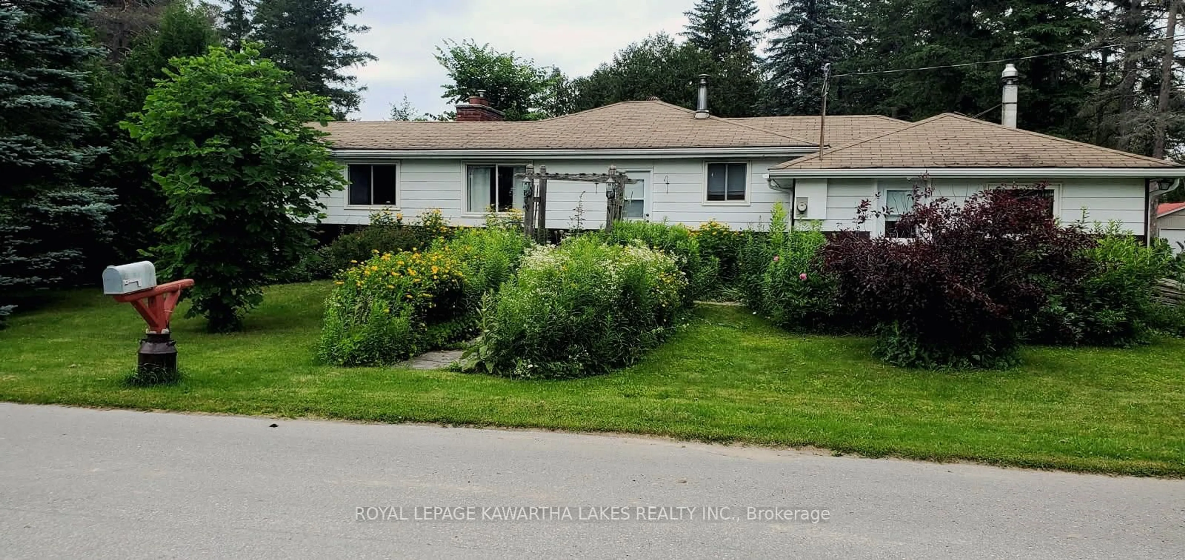 Home with vinyl exterior material, street for 85 Thomas Dr, Kawartha Lakes Ontario K0M 1N0
