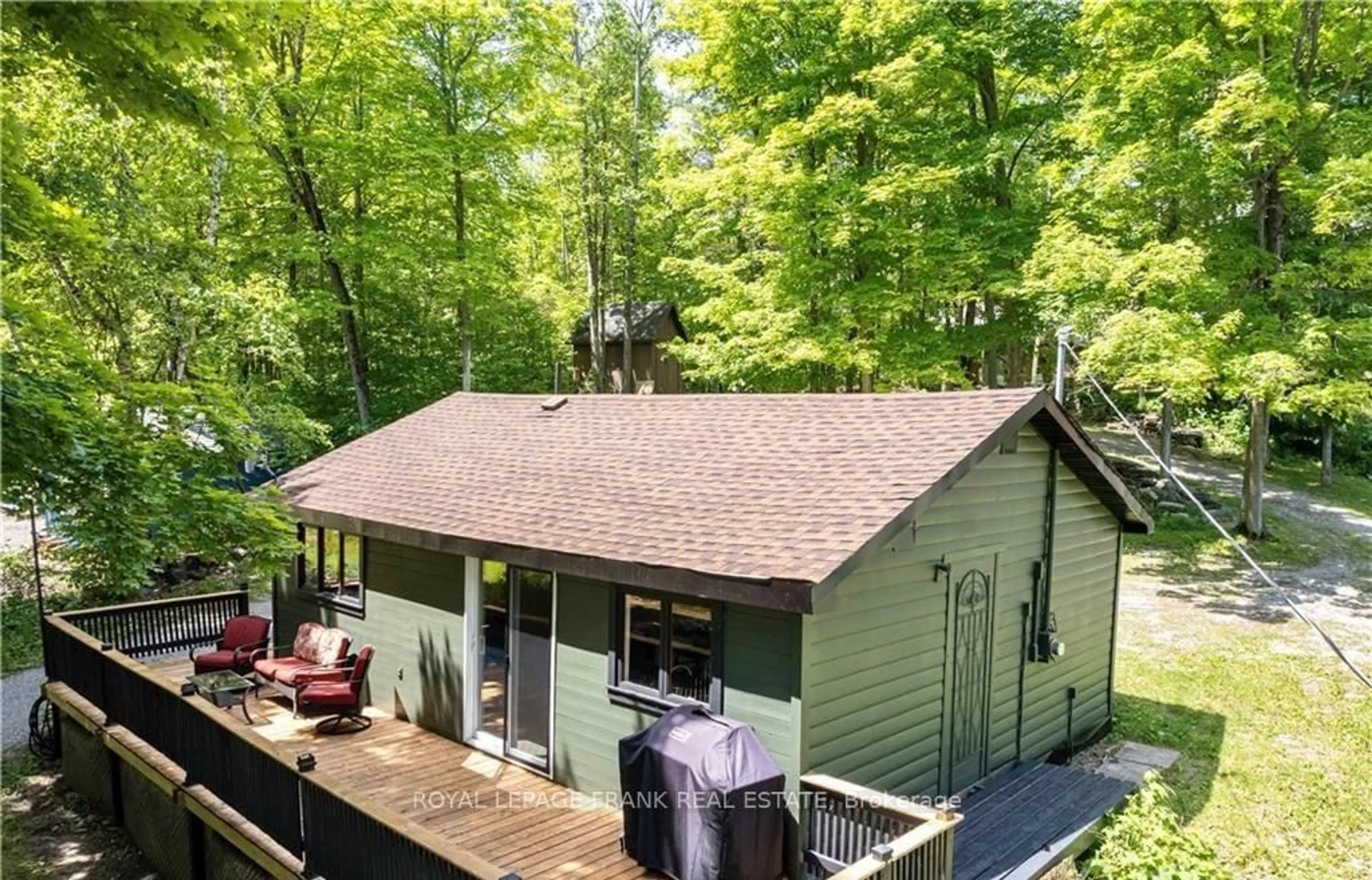 A pic from outside/outdoor area/front of a property/back of a property/a pic from drone, forest/trees view for 8 Fire Route 27, Trent Lakes Ontario K0L 1J0