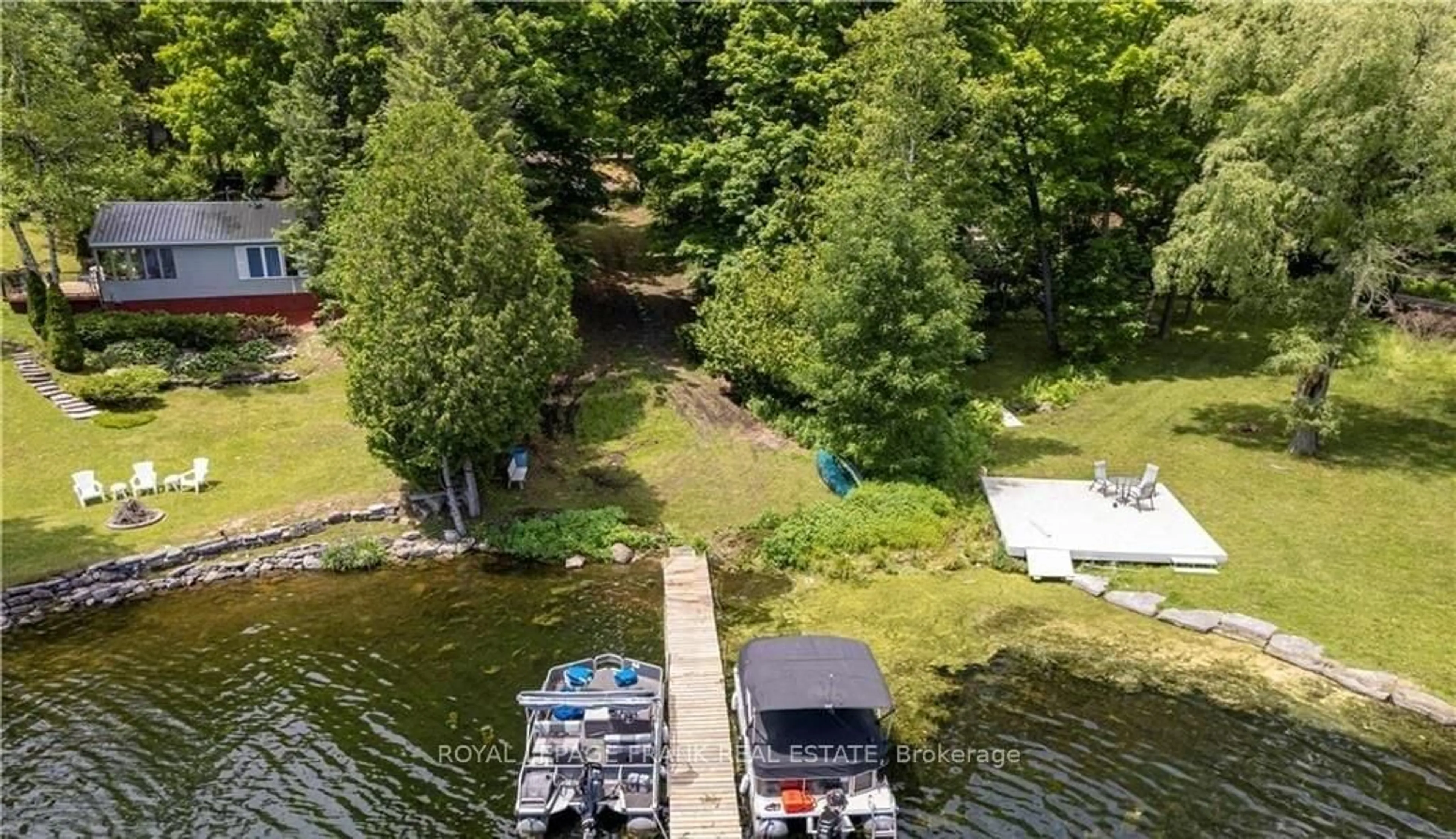 A pic from outside/outdoor area/front of a property/back of a property/a pic from drone, water/lake/river/ocean view for 8 Fire Route 27, Trent Lakes Ontario K0L 1J0
