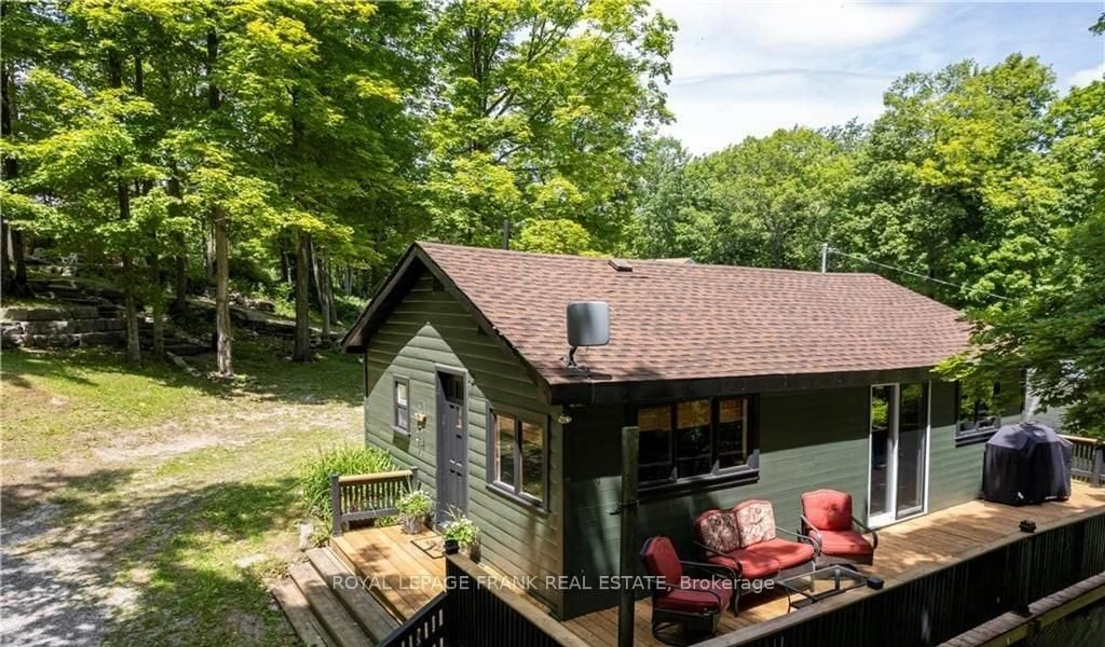 A pic from outside/outdoor area/front of a property/back of a property/a pic from drone, forest/trees view for 8 Fire Route 27, Trent Lakes Ontario K0L 1J0