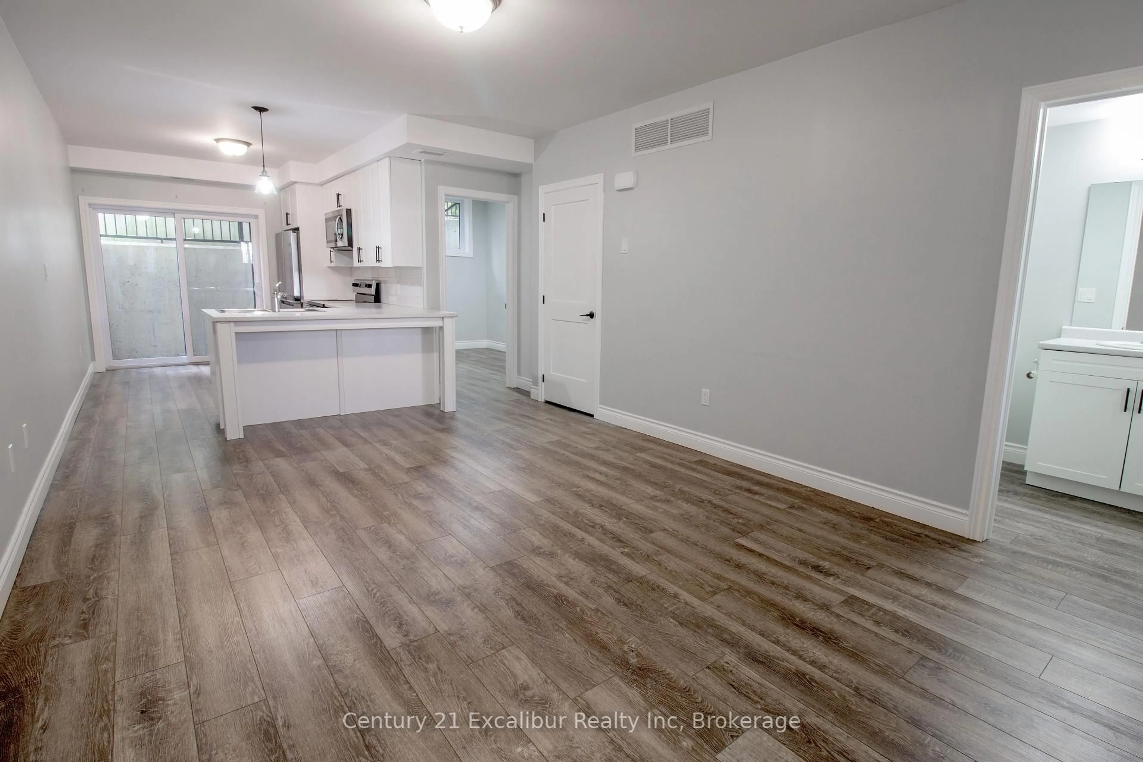 Open concept kitchen, wood/laminate floor for 360 Queen St #5A, Centre Wellington Ontario N1M 1T4