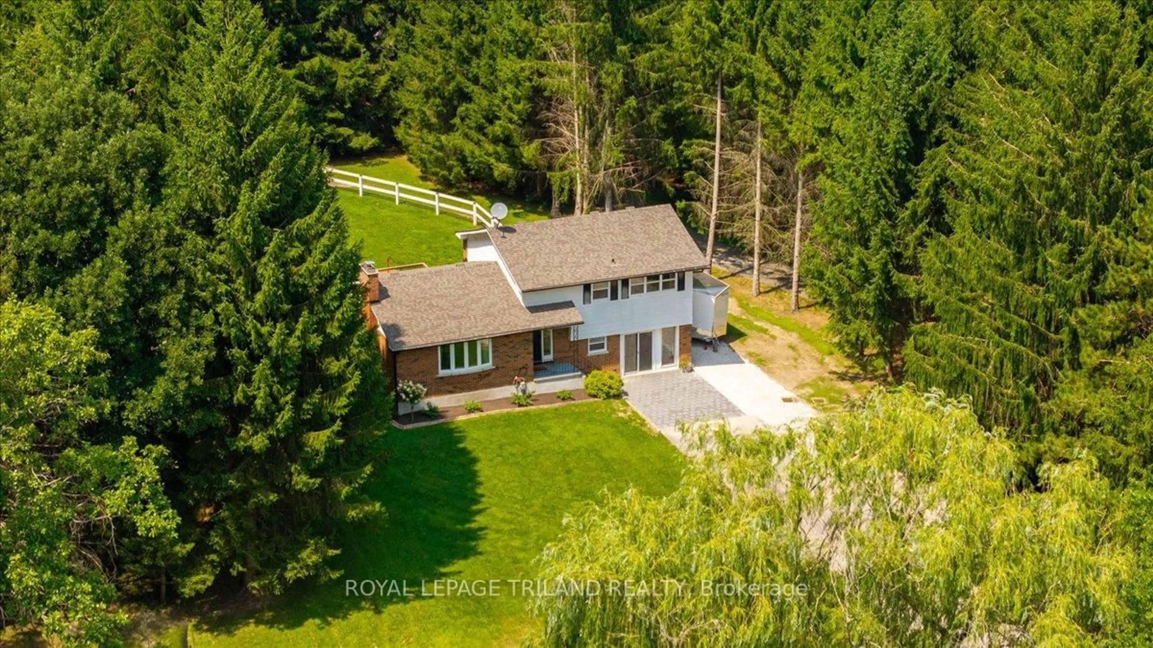 A pic from outside/outdoor area/front of a property/back of a property/a pic from drone, forest/trees view for 5746 GLENDON Dr, Southwest Middlesex Ontario N0L 1A0