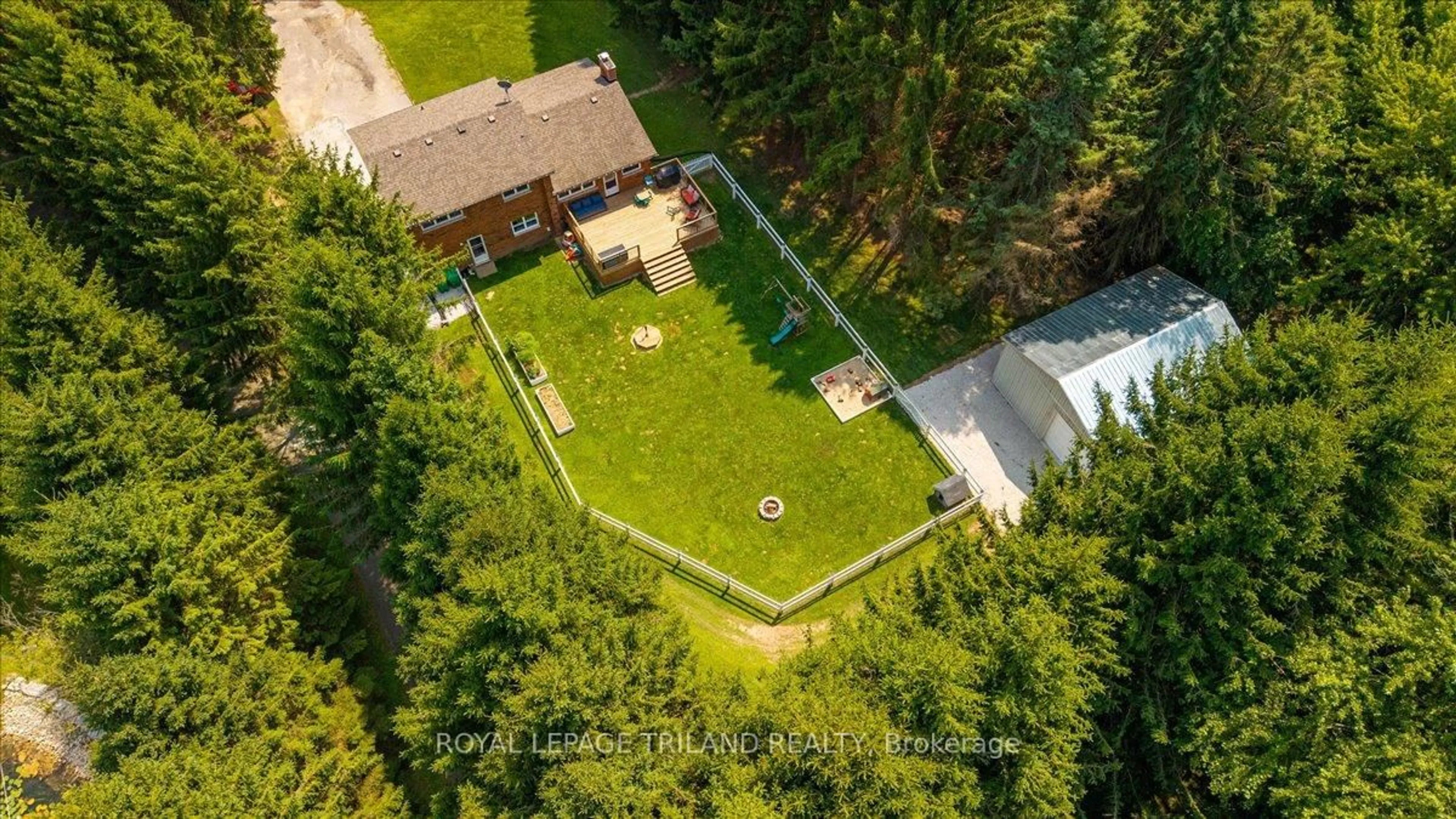 A pic from outside/outdoor area/front of a property/back of a property/a pic from drone, forest/trees view for 5746 GLENDON Dr, Southwest Middlesex Ontario N0L 1A0