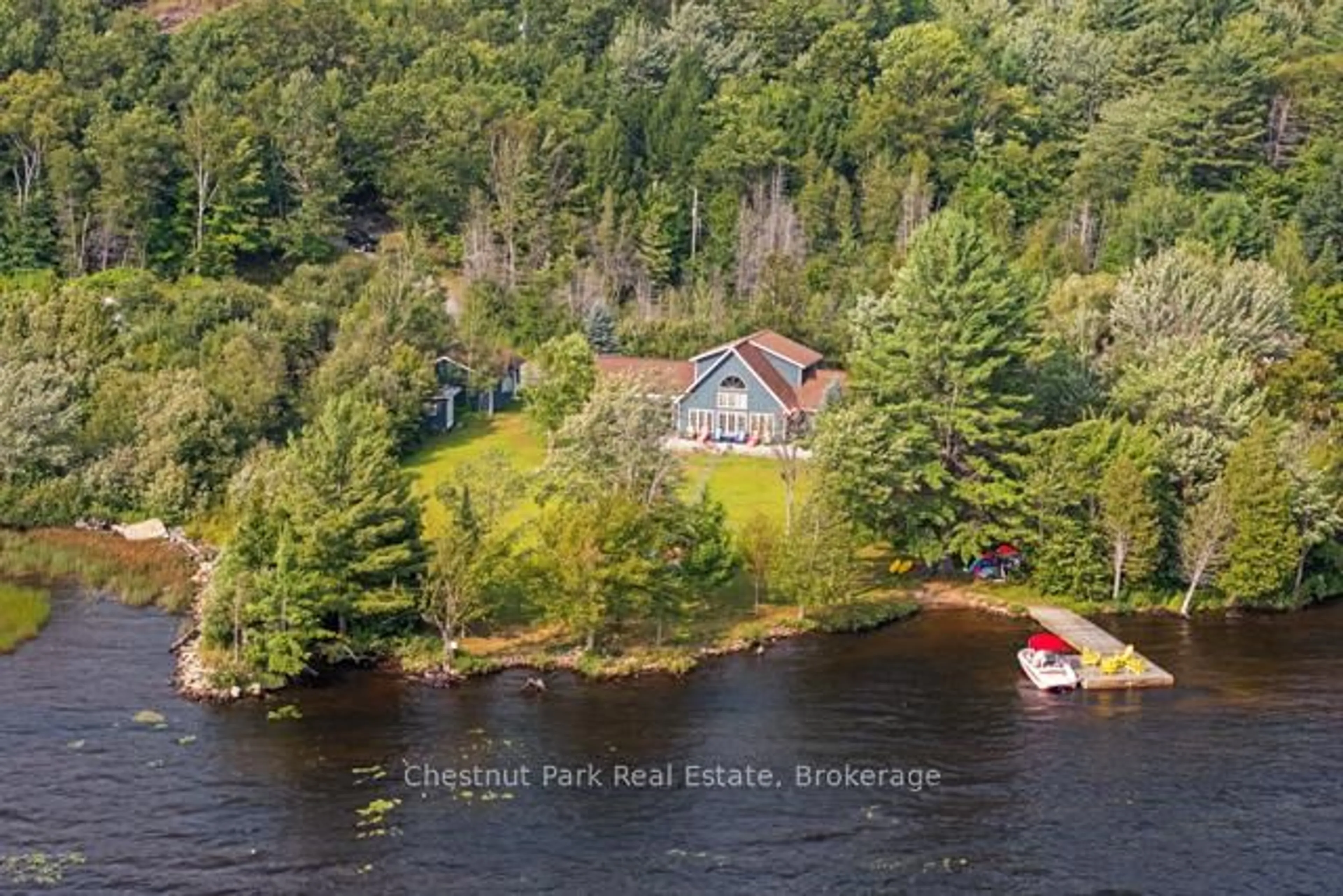 A pic from outside/outdoor area/front of a property/back of a property/a pic from drone, water/lake/river/ocean view for 82 Seelys Rd, Huntsville Ontario P1H 2J3