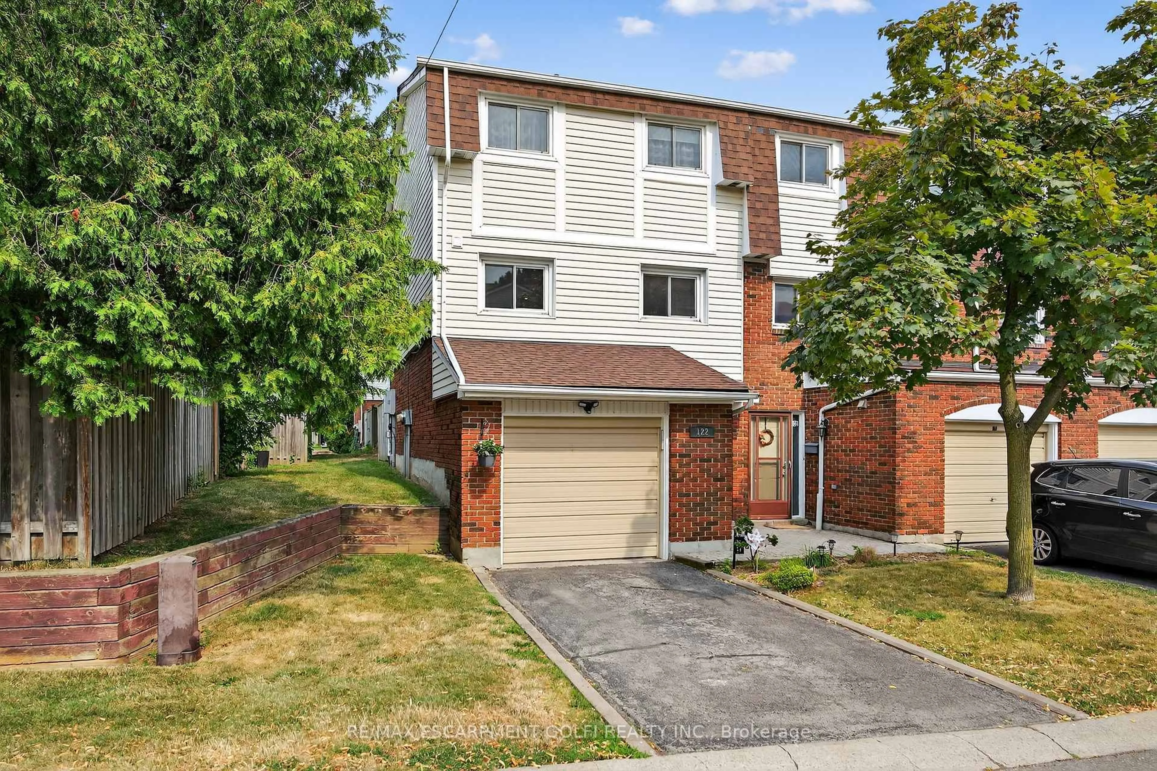 Home with brick exterior material, street for 11 Harrisford St #122, Hamilton Ontario L8K 6L7