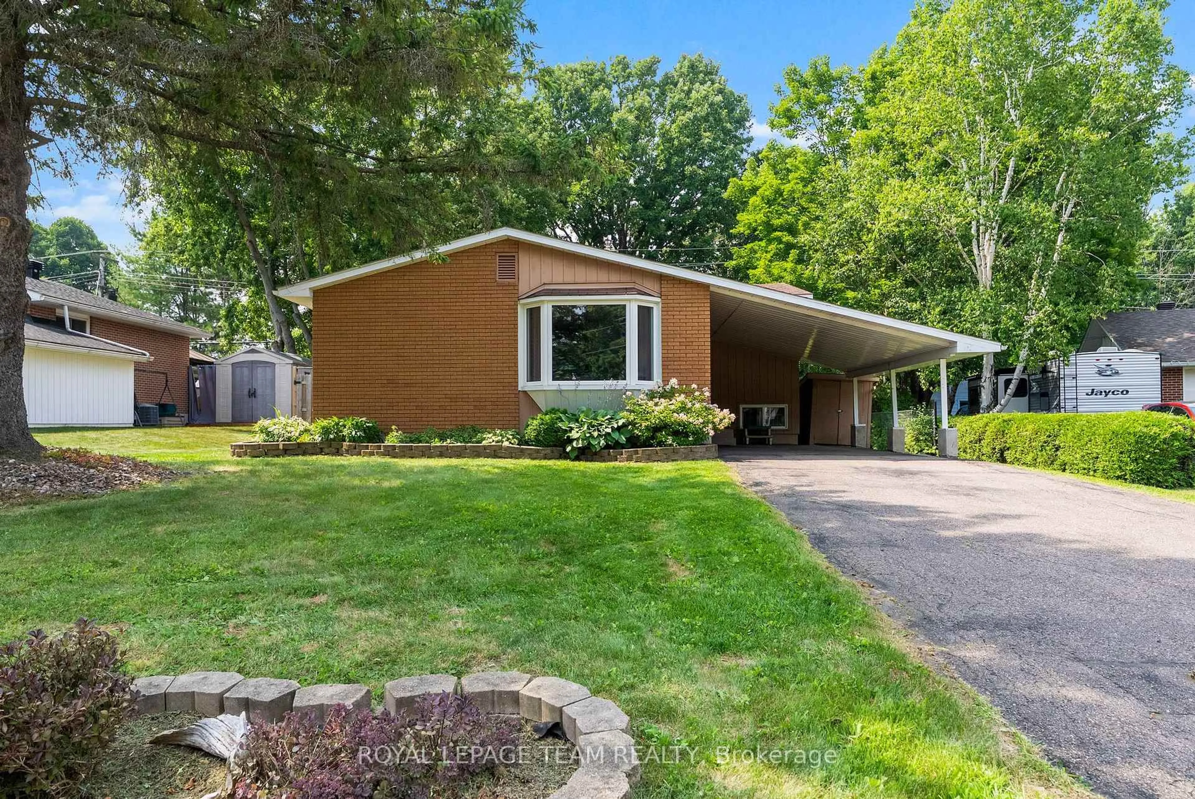 Home with vinyl exterior material, street for 132 Pine Ave, Renfrew Ontario K7V 2P9