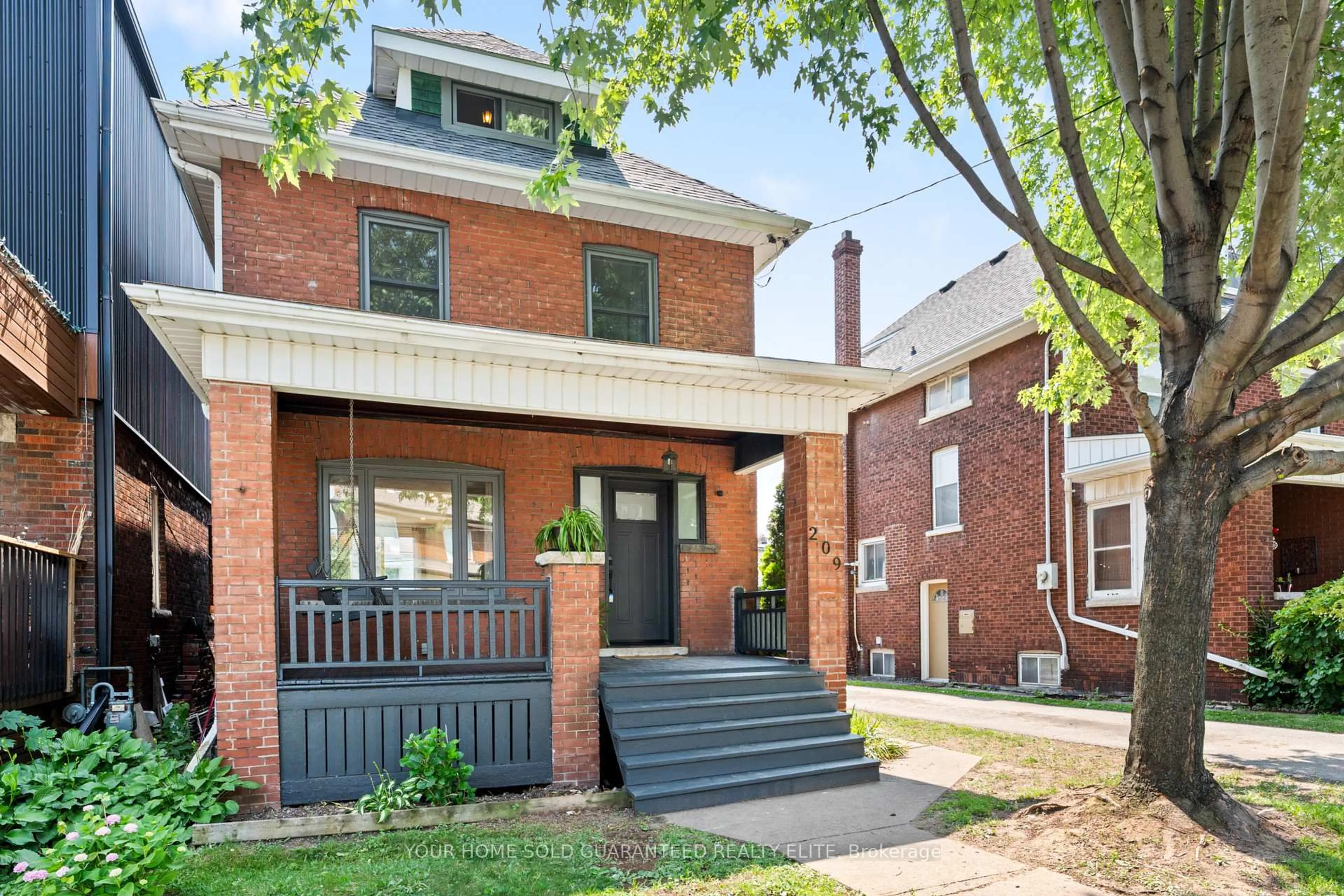 Home with brick exterior material, street for 209 Rothsay Ave, Hamilton Ontario L8M 3G6