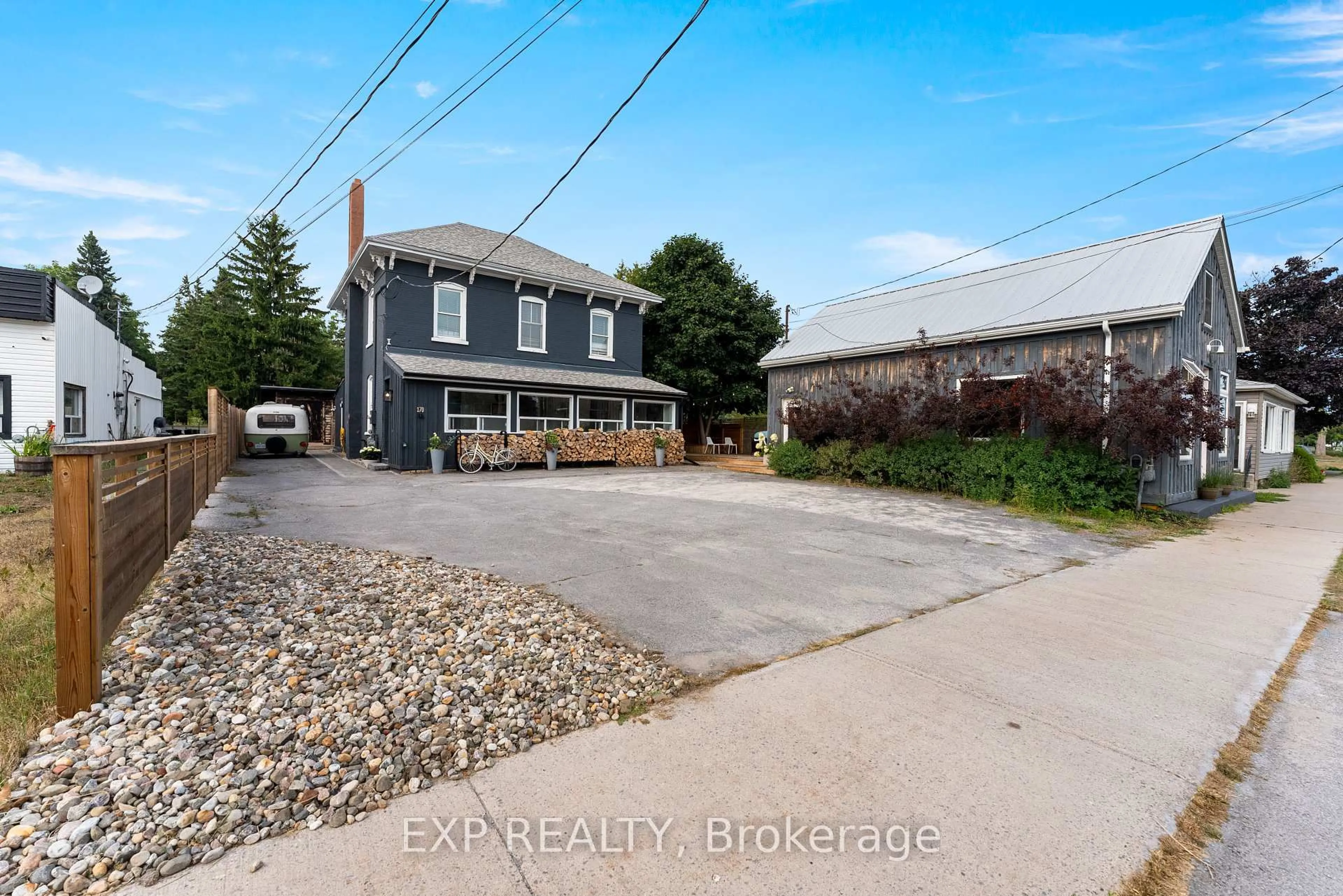 A pic from outside/outdoor area/front of a property/back of a property/a pic from drone, street for 168-170 Main St, Prince Edward County Ontario K0K 3L0