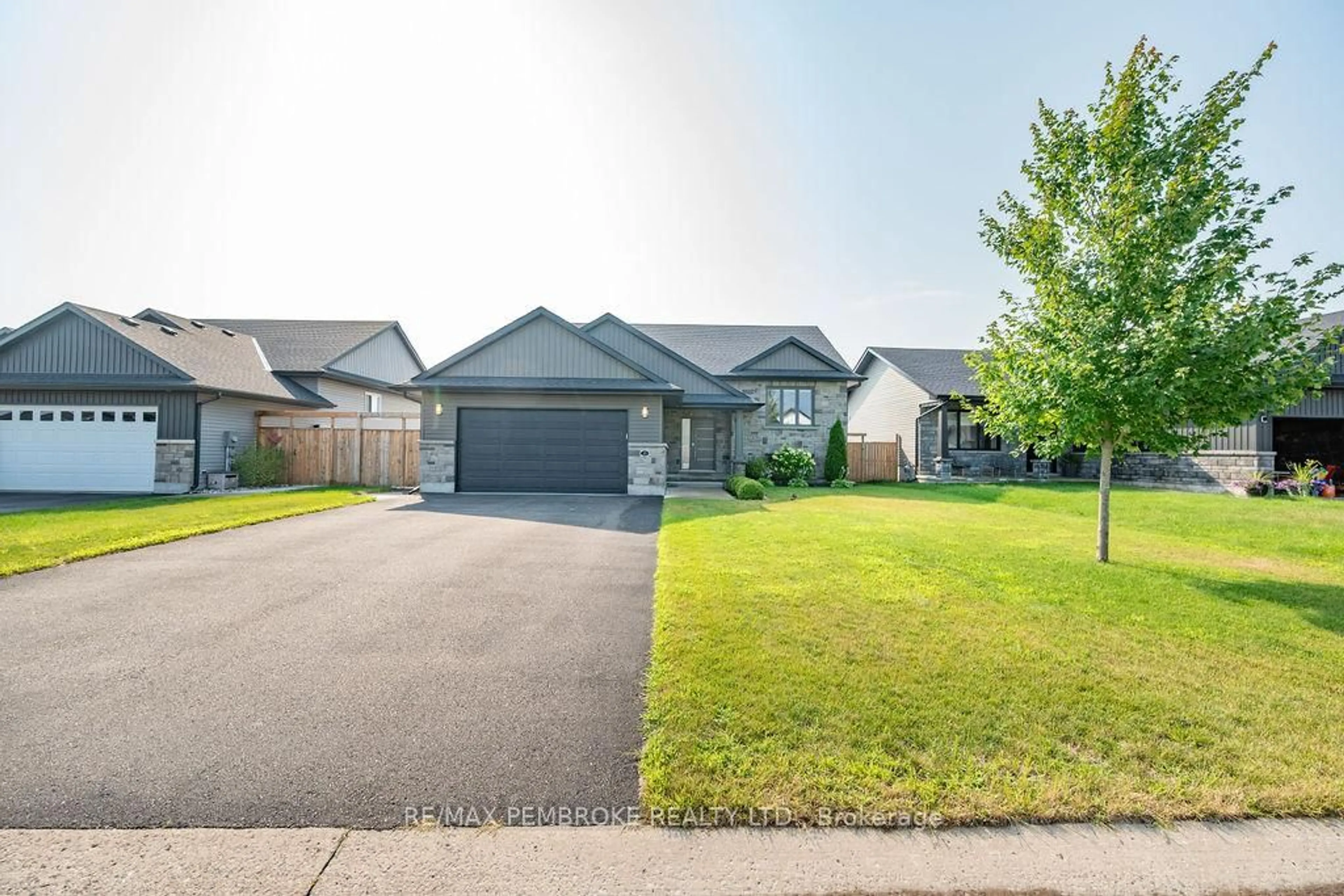 A pic from outside/outdoor area/front of a property/back of a property/a pic from drone, street for 13 Drew St, Petawawa Ontario K8H 0G4