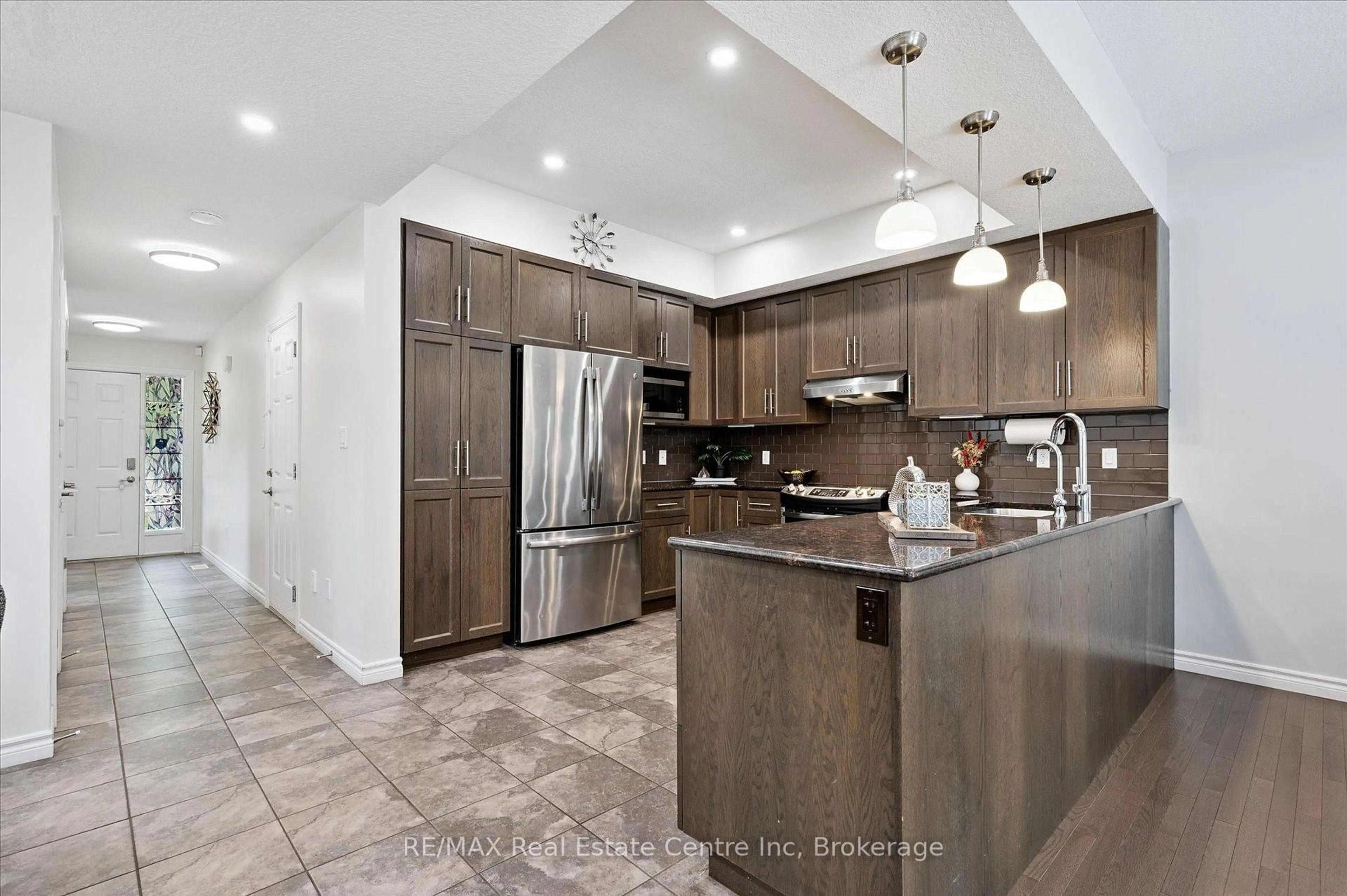 Open concept kitchen, ceramic/tile floor for 68 York Rd #B, Guelph Ontario N1E 3E6