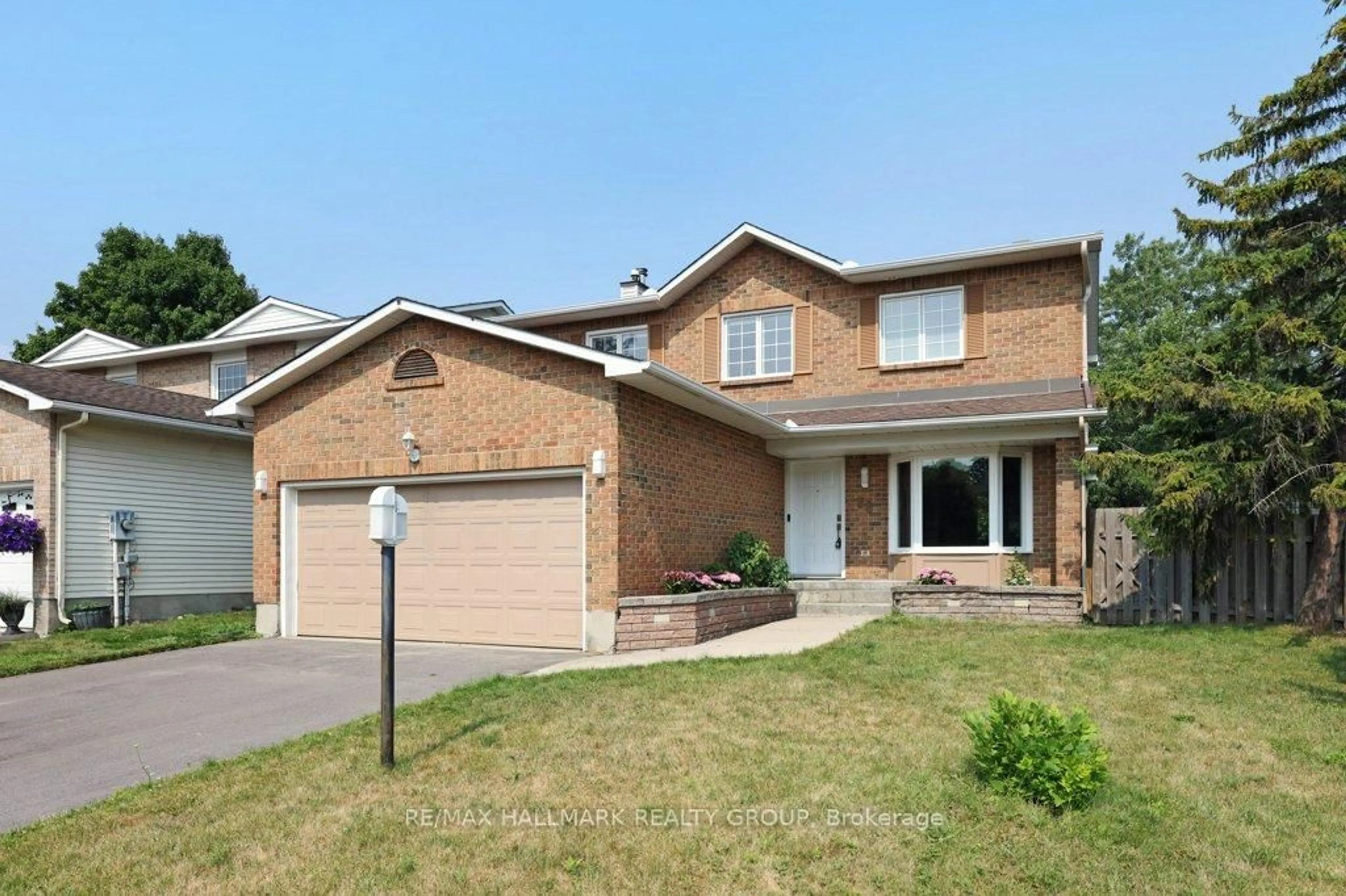 Home with brick exterior material, street for 36 Drainie Dr, Kanata Ontario K2L 3J9