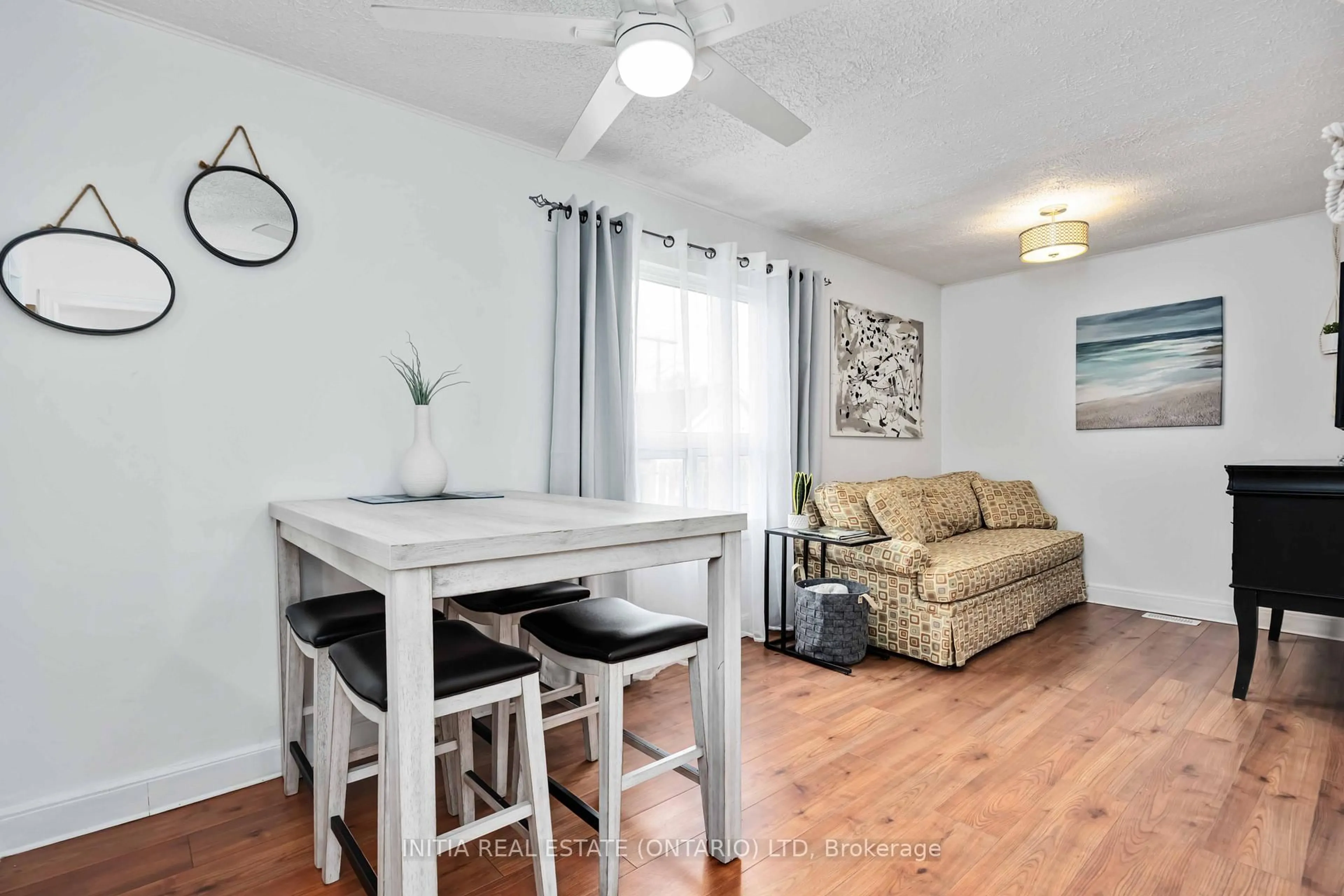 Living room with furniture, wood/laminate floor for 187 Maxwell St, Sarnia Ontario N7T 5C2
