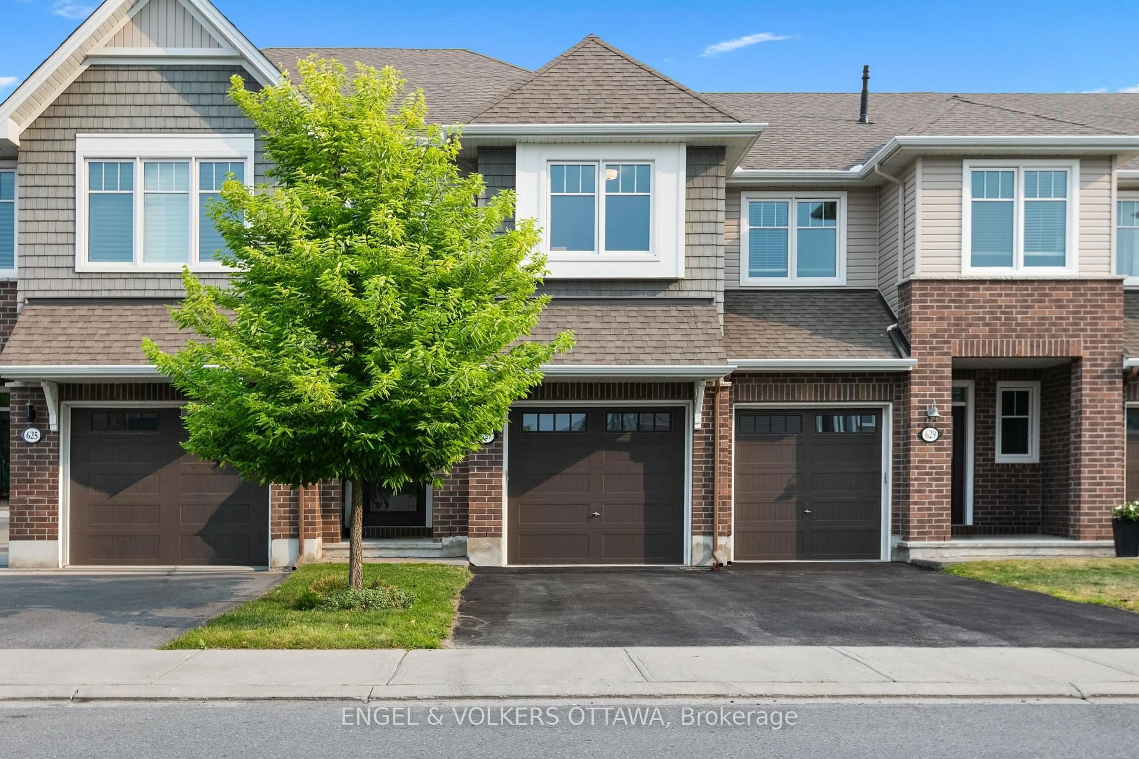 Home with brick exterior material, street for 627 Egret Way, Ottawa Ontario K2J 6K9