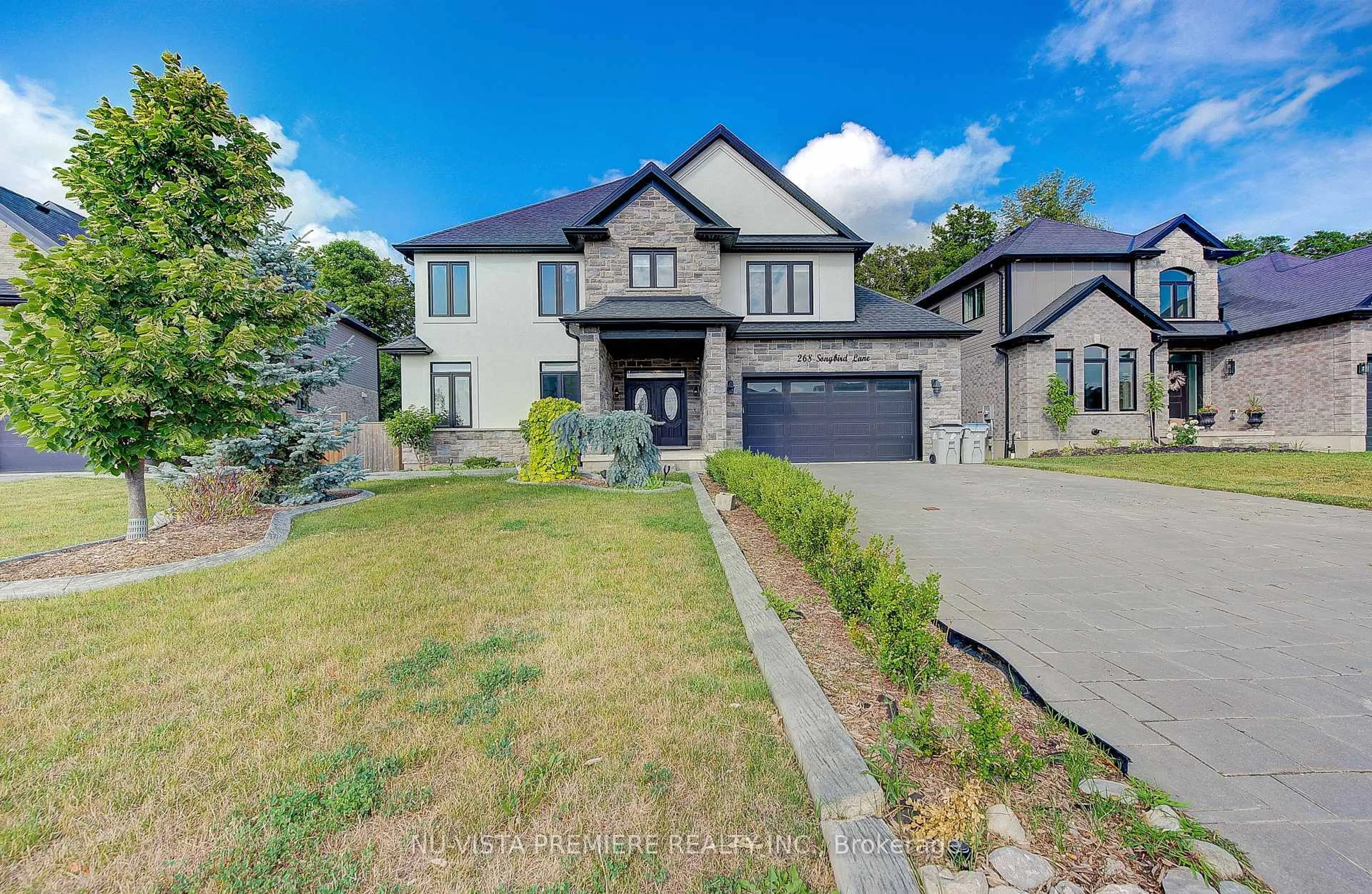 Home with brick exterior material, street for 268 SONGBIRD Lane, Middlesex Centre Ontario N0M 2A0