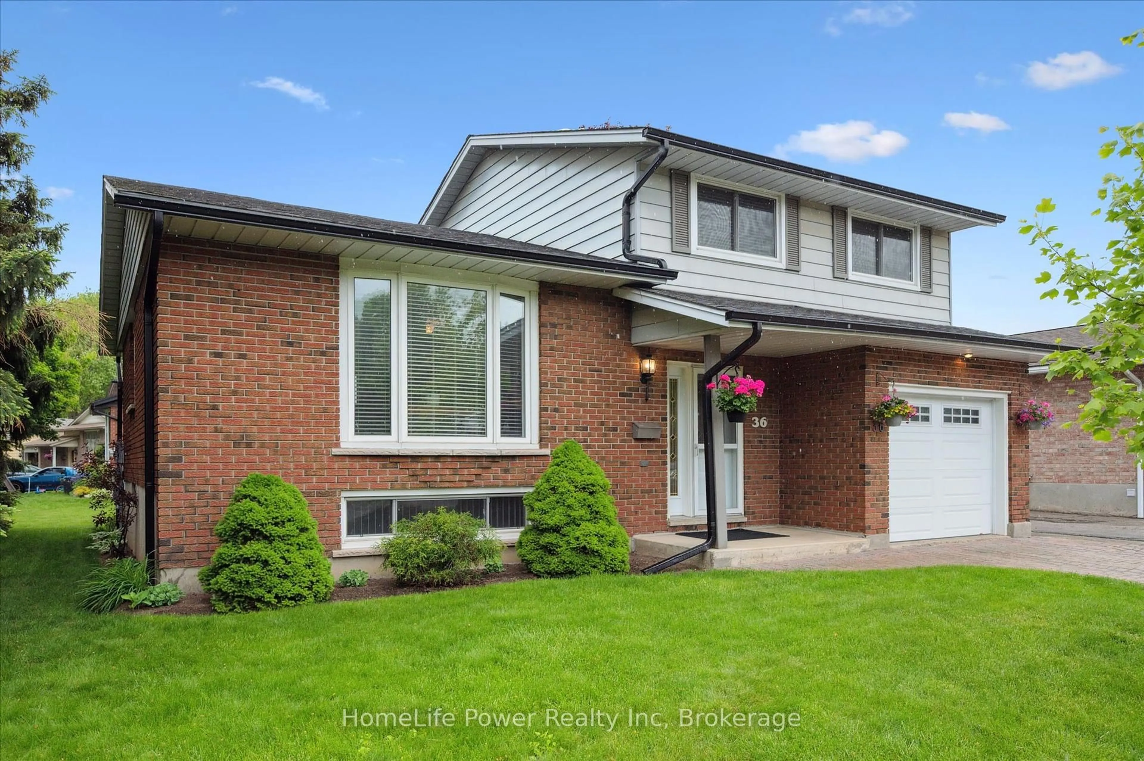 Home with brick exterior material, street for 36 Sanderson Dr, Guelph Ontario N1H 7B8